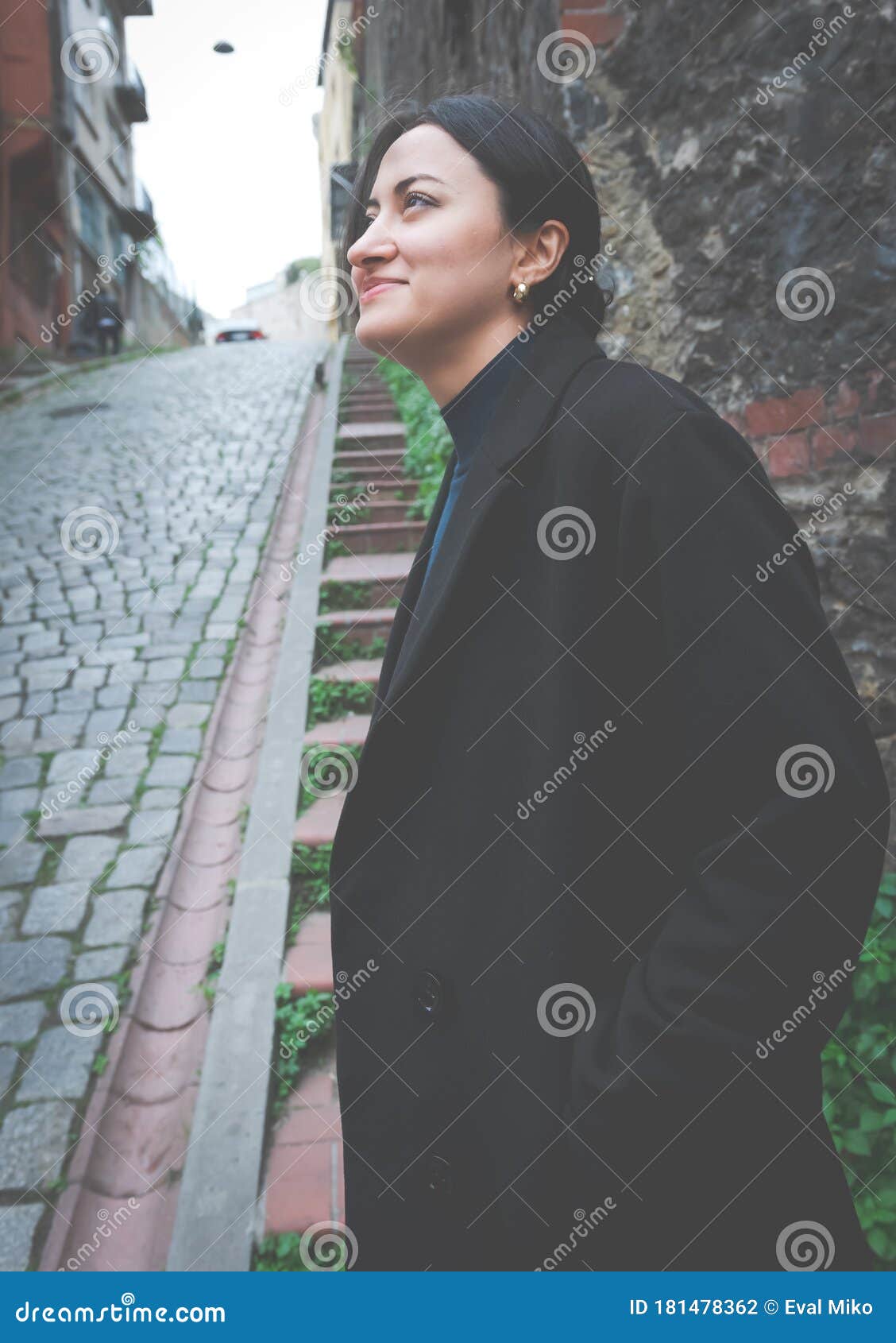 Girl in black by the wall stock photo. Image of female - 181478362