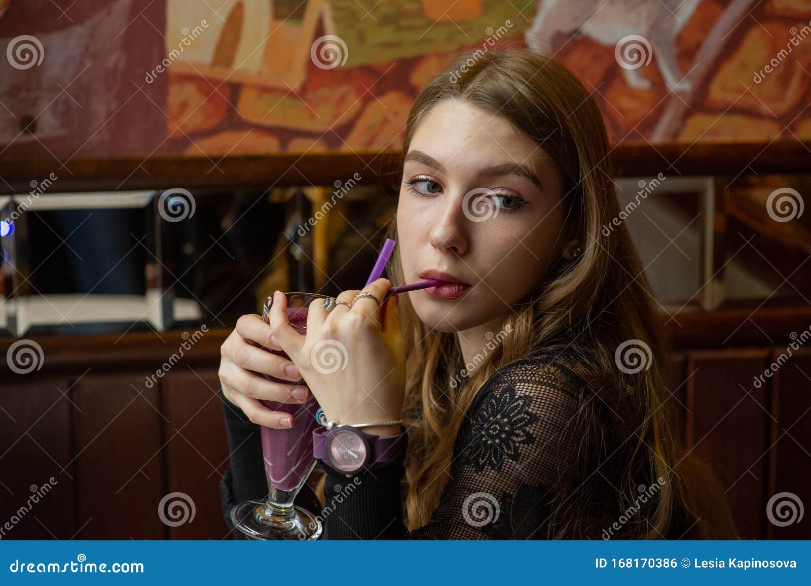 Girl in a Black Dress with a Cocktail in a Cafe Stock Photo - Image of ...