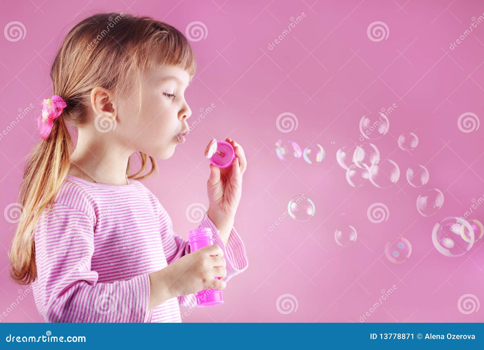 Girl Blowing Soap Bubbles Stock Image - Image: 13778871