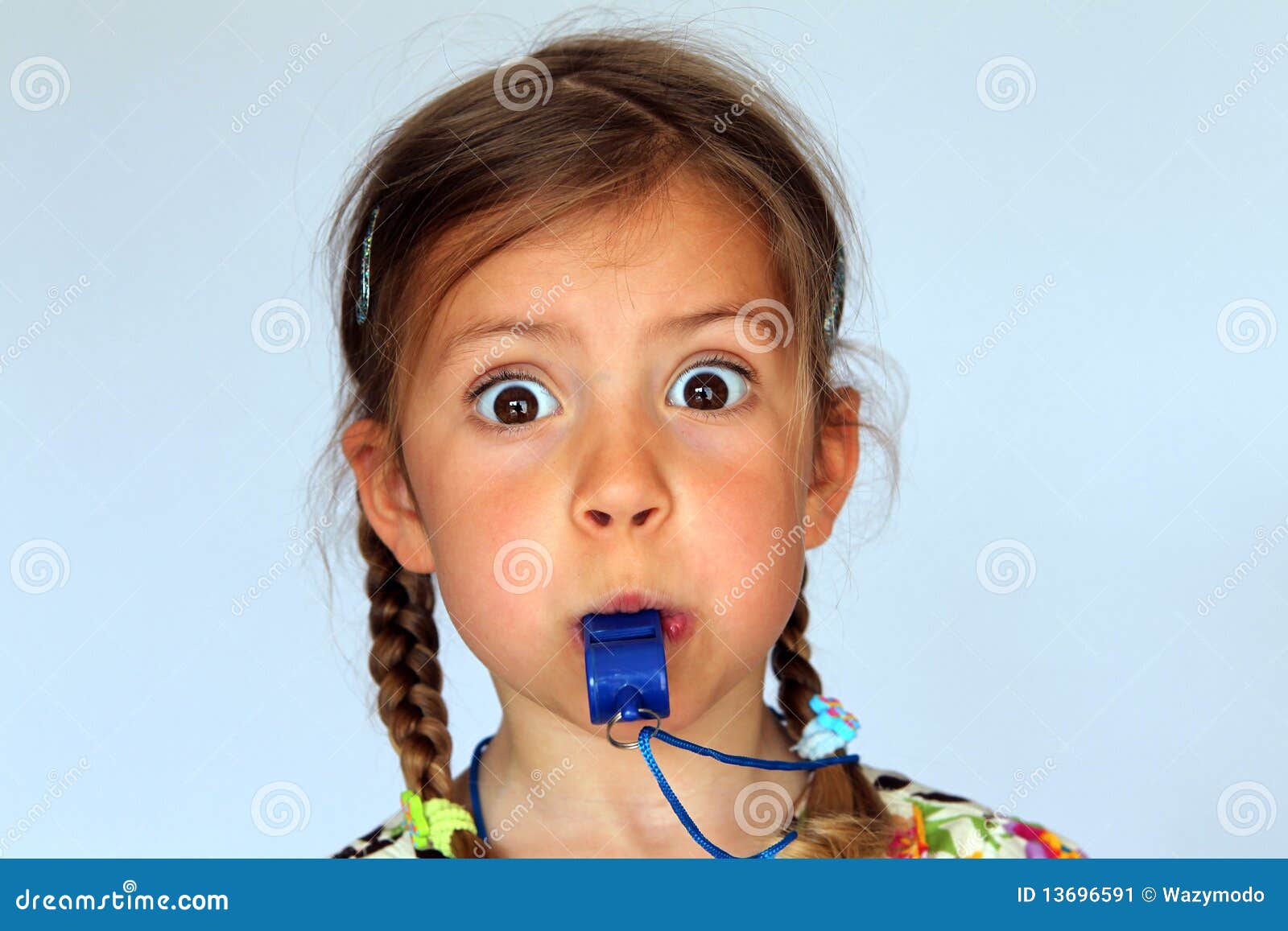 girl blowing whistle
