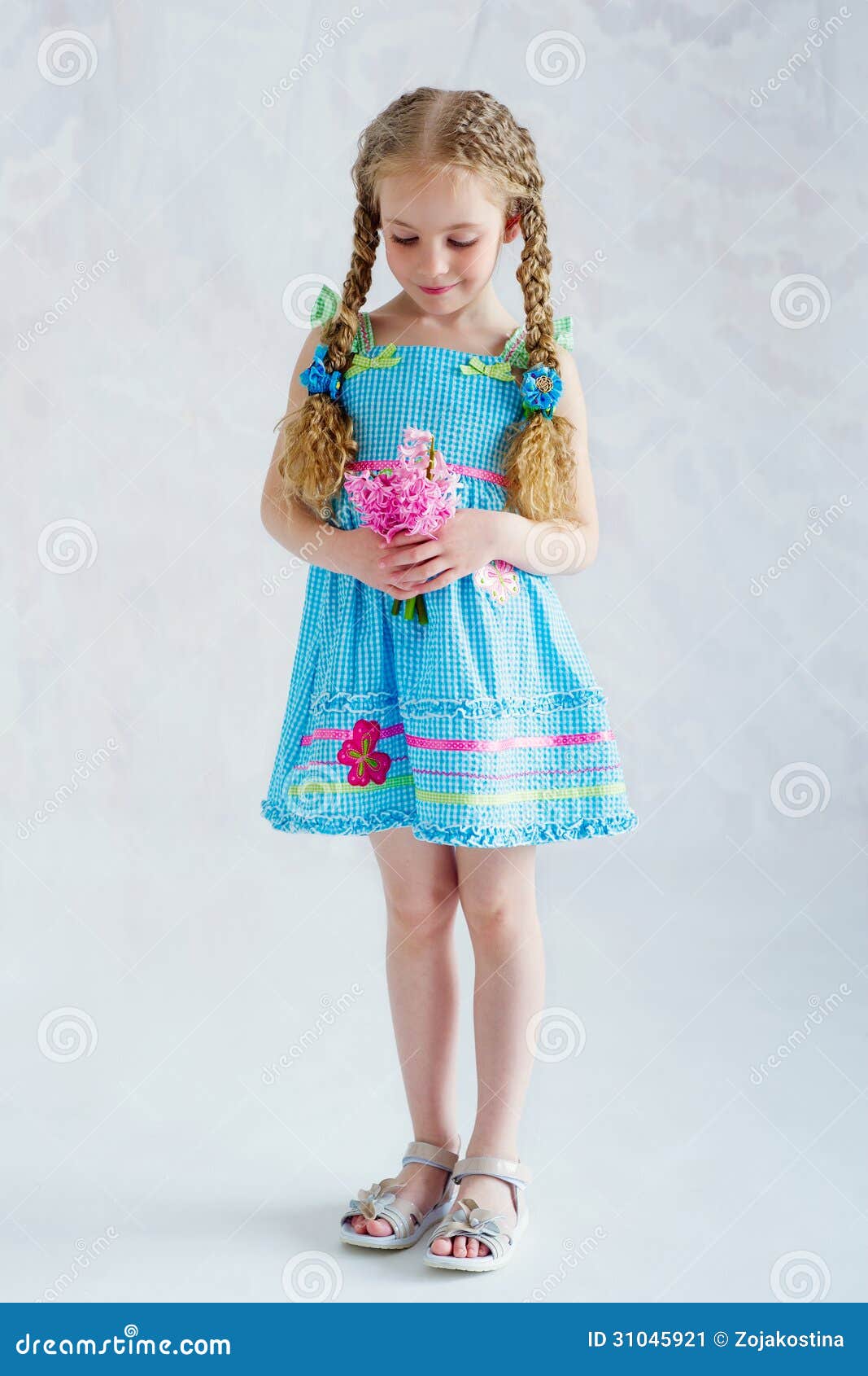 Girl in Blue Dress with Flowers Stock ...