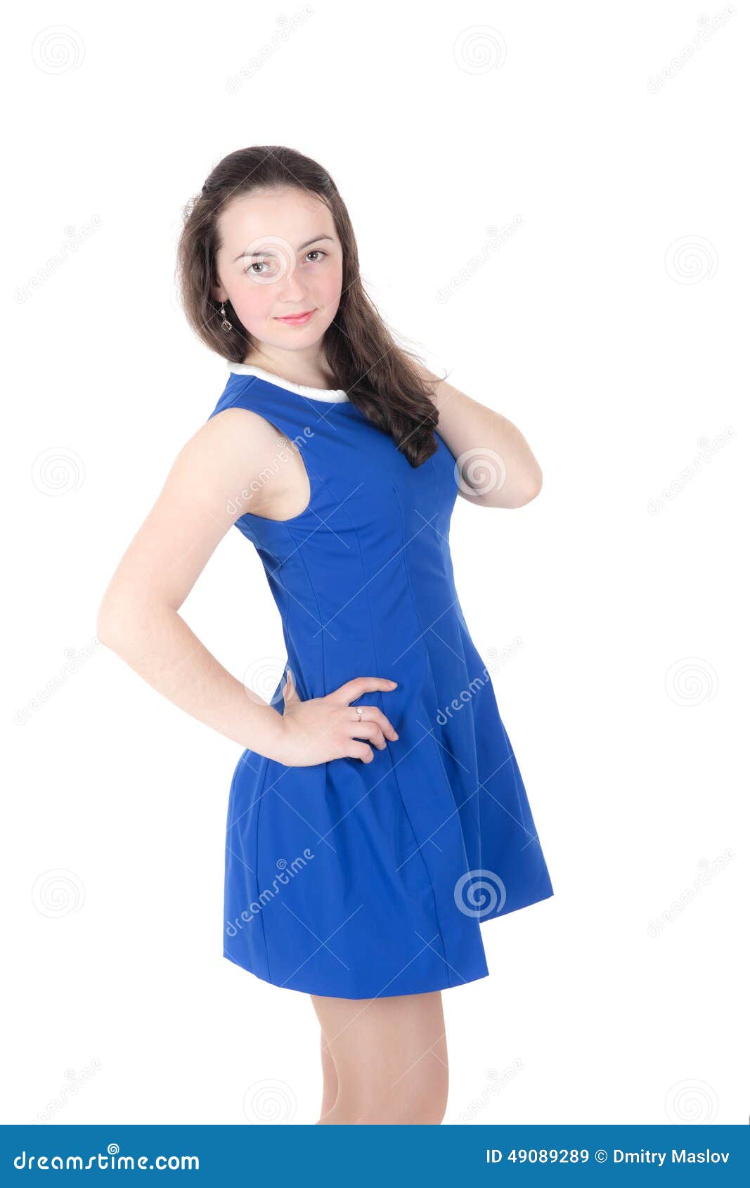 Portrait of a beautiful teenager girl in a blue dress
