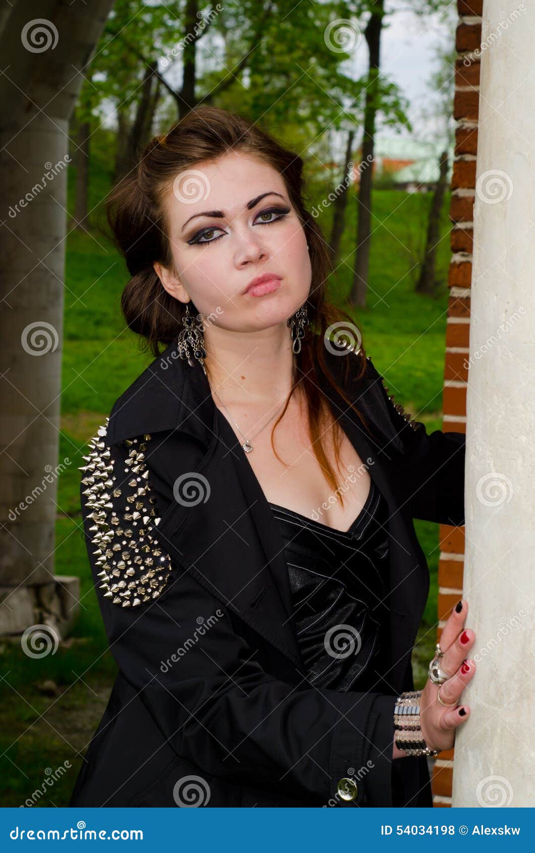 The girl at a brick wall stock photo. Image of eyes, holding - 54034198