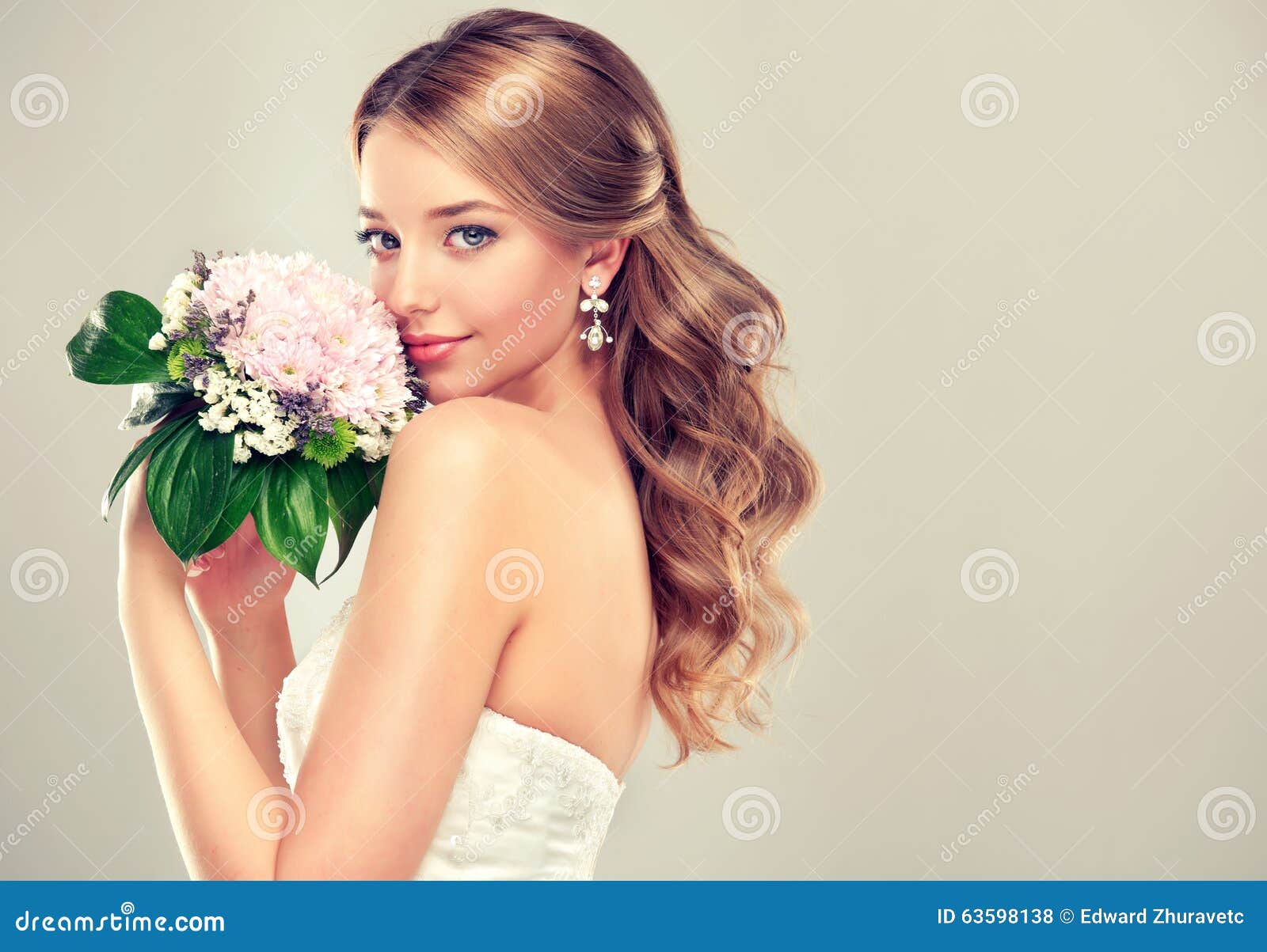 girl bride in wedding dress with elegant hairstyle.