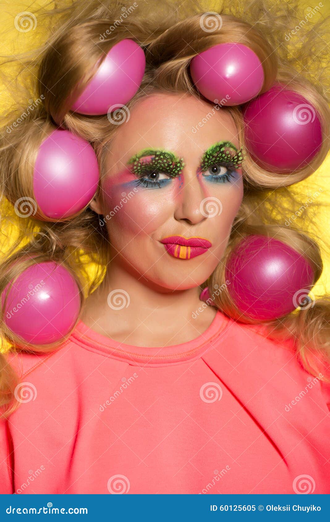 Girl with Bright Makeup and Hair Balls on Yellow Background Stock Image ...