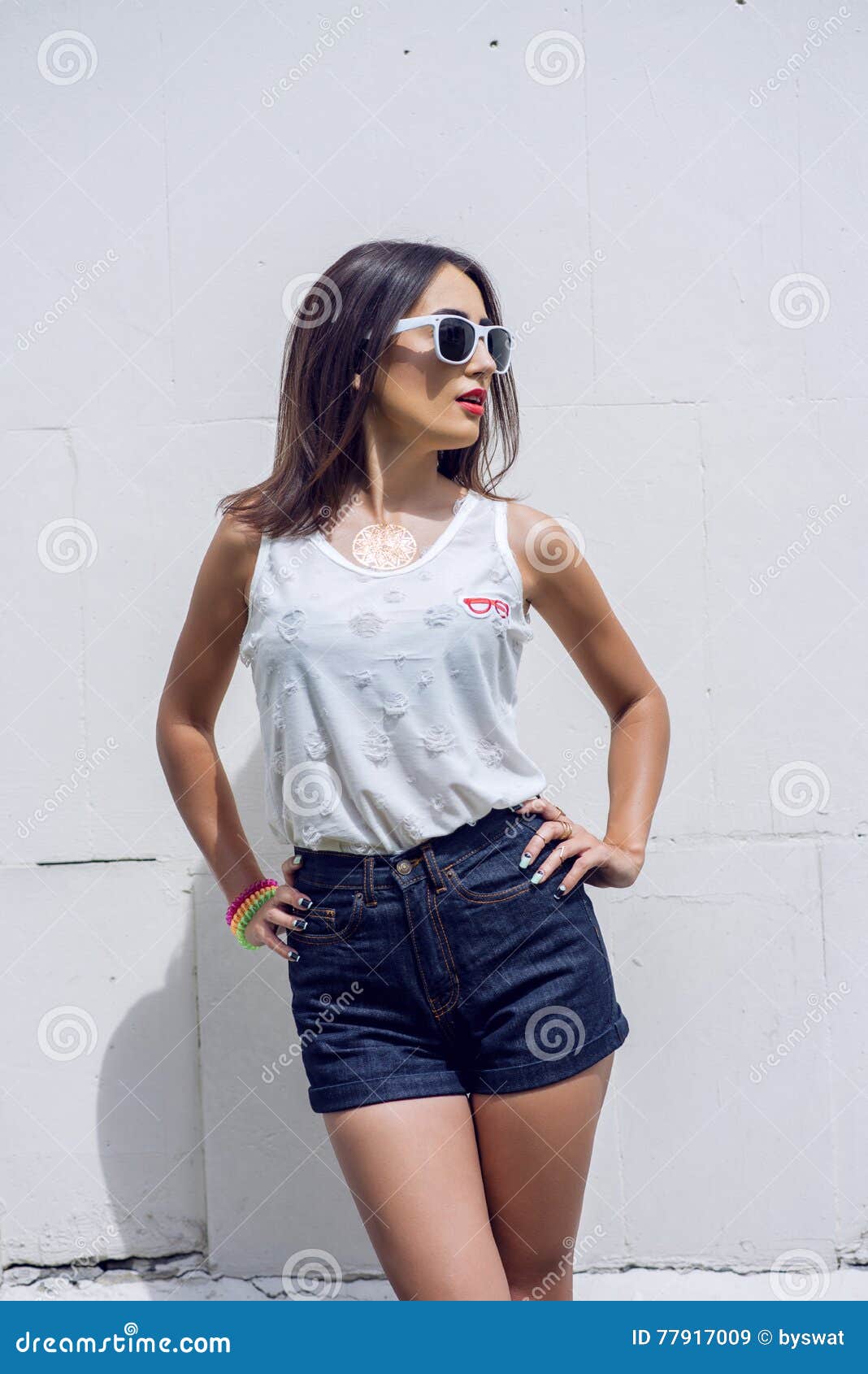 Girl Brunette in Summer in the Park with Resting in Shorts and a White ...