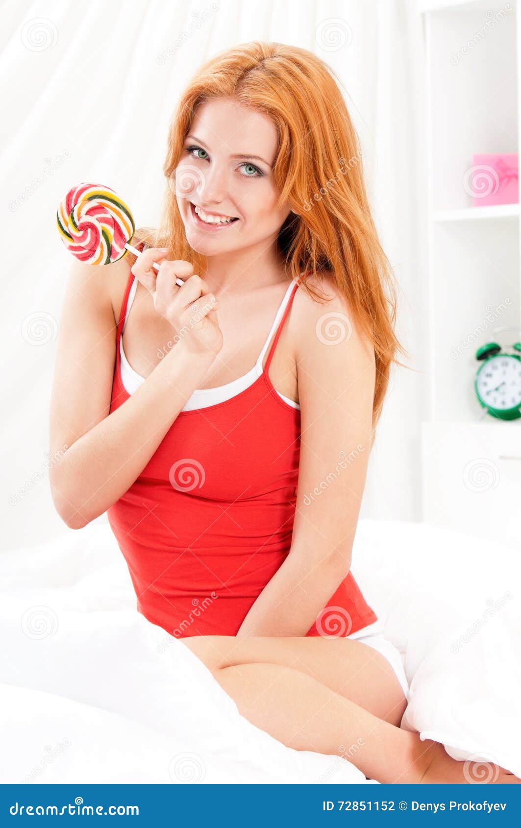 A cute teenage girl in underwear and candy lollipop, Stock Photo
