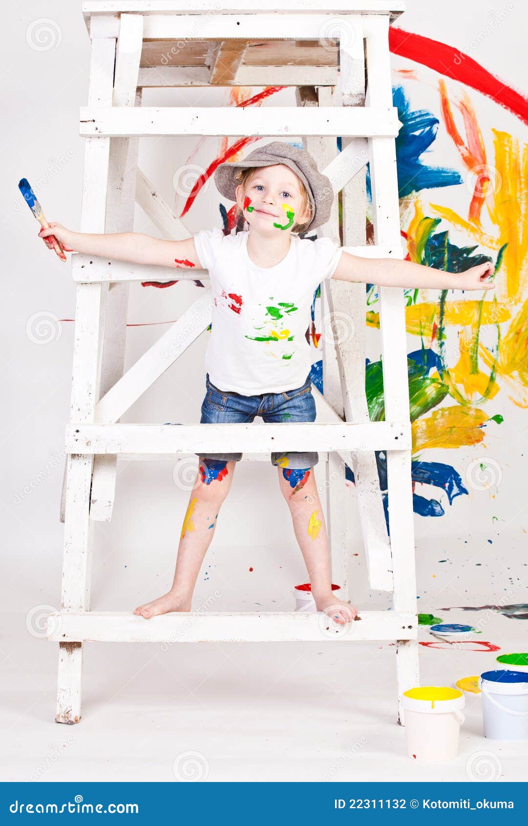 Girl in a cap with paints stock photo. Image of brush 22311132