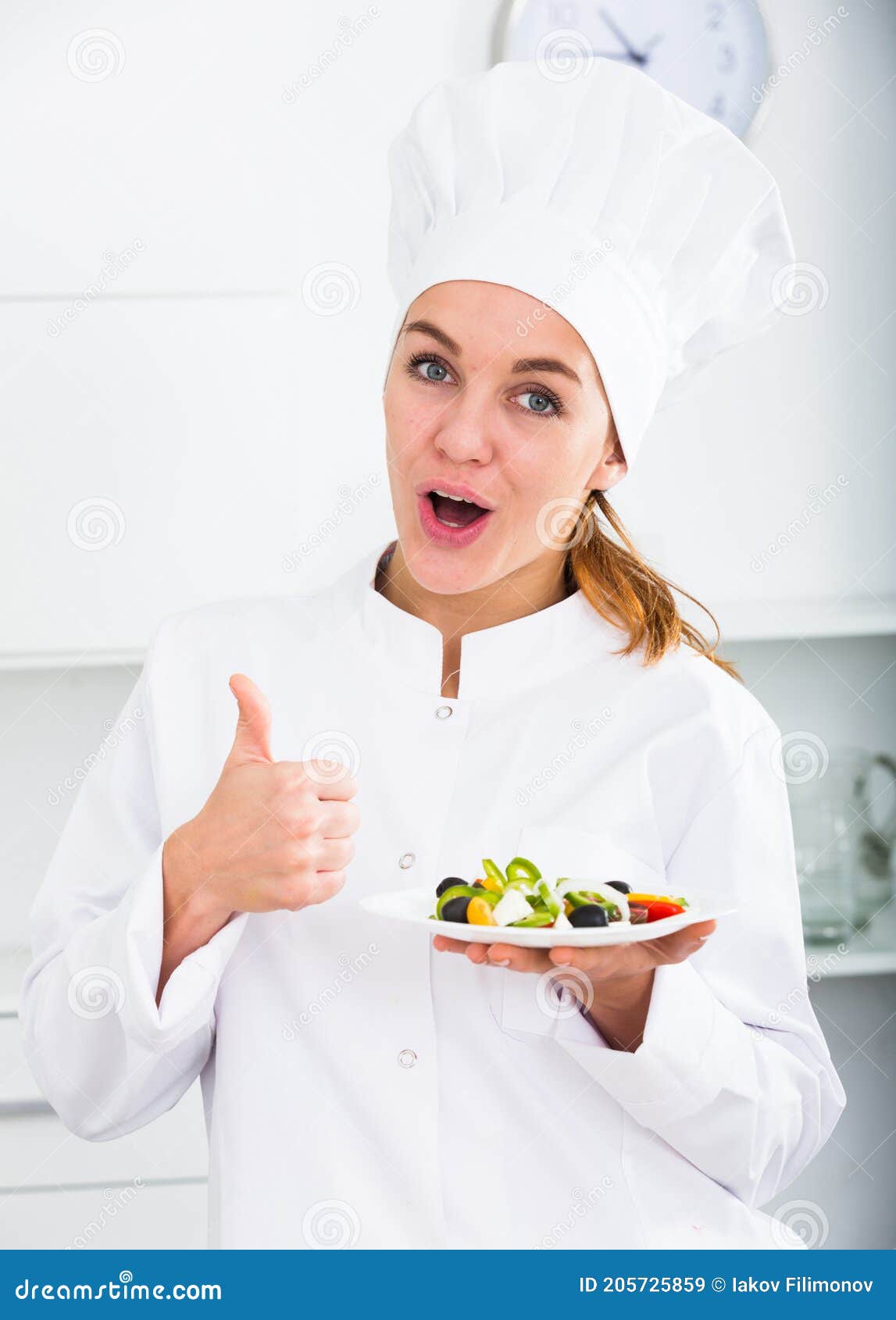 Girl in Chef`s Hat and White Coat Showing Salad Stock Image - Image of ...