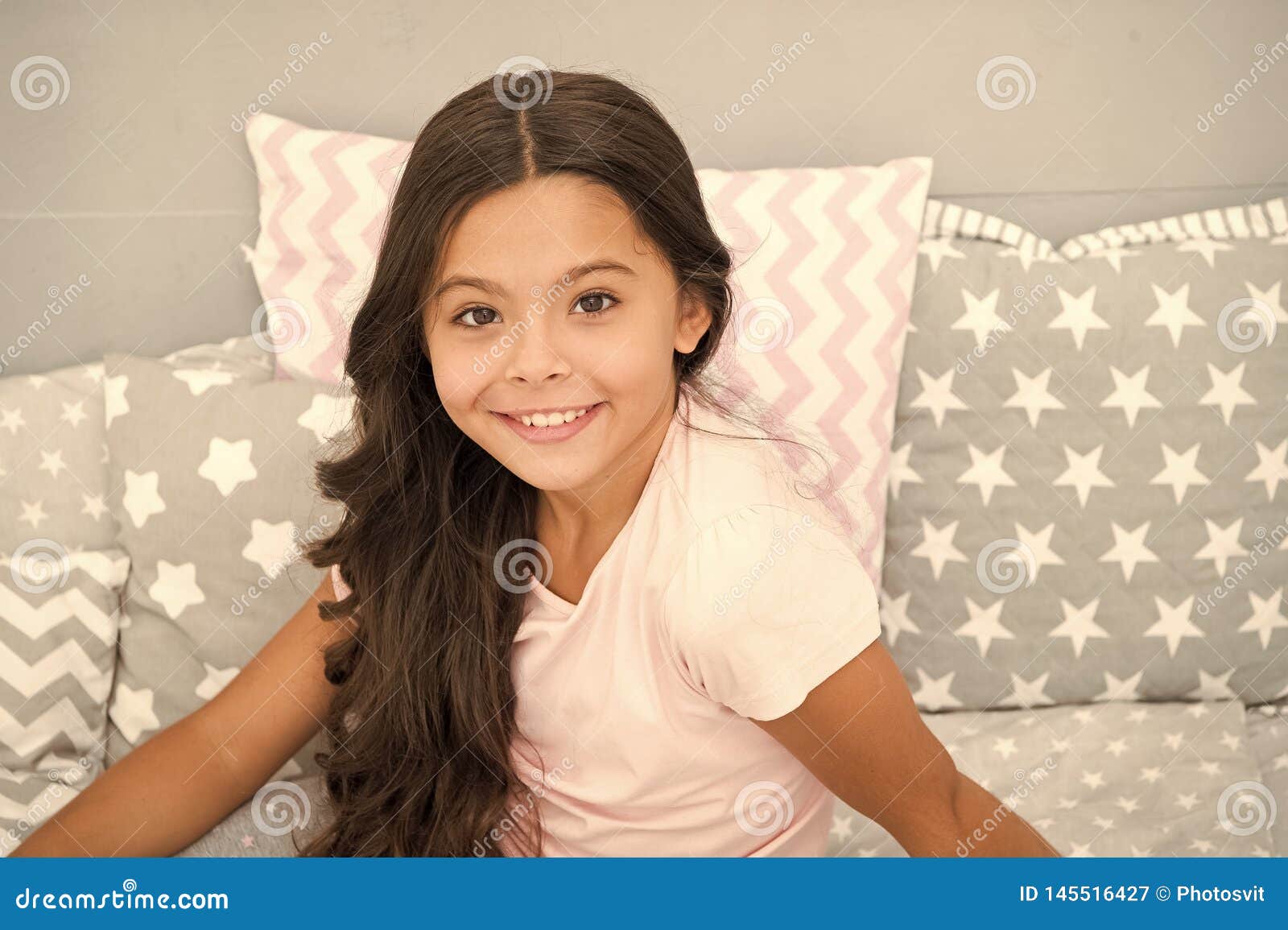 Girl Child With Long Curly Hair Grey Interior Background