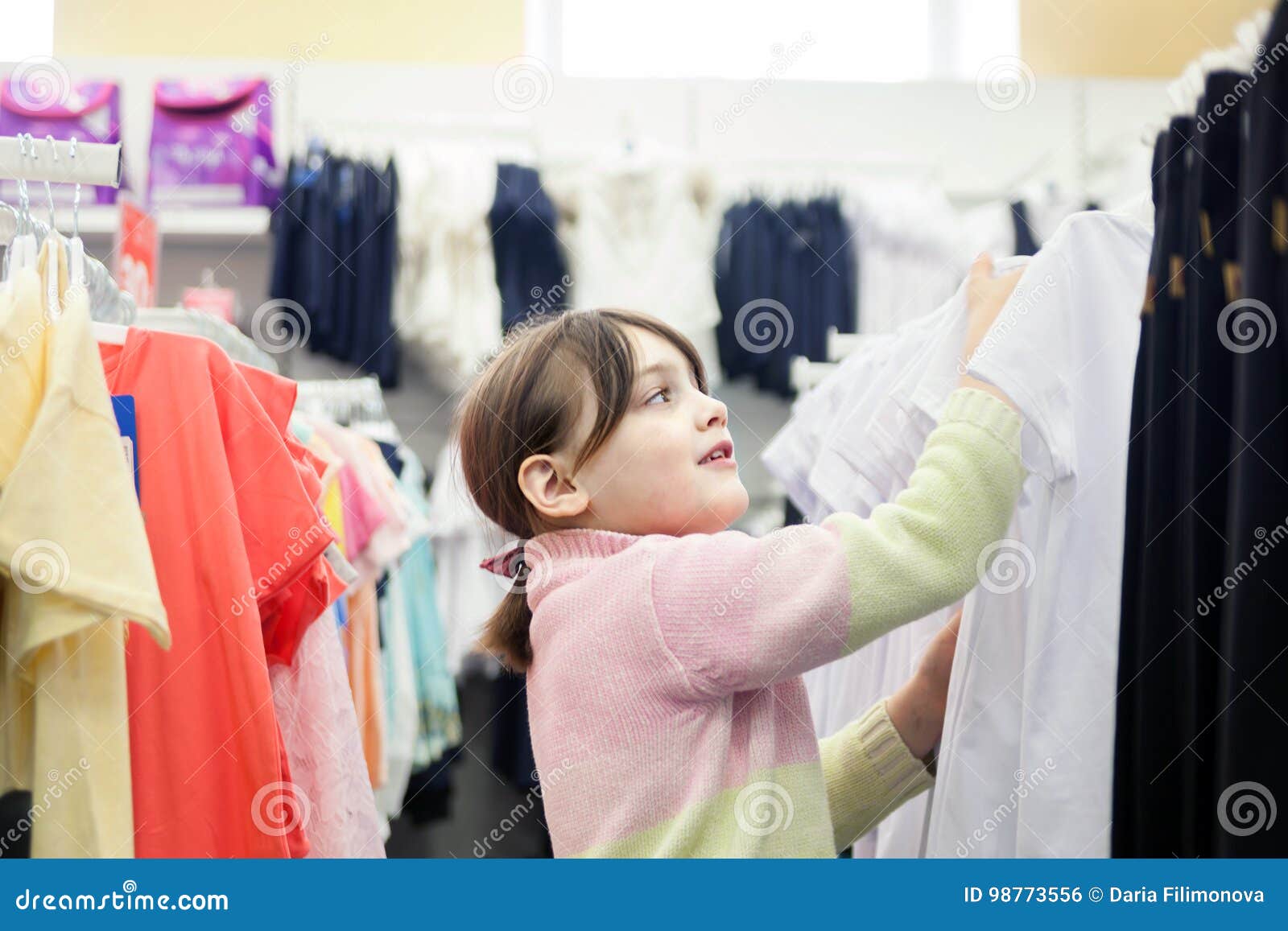 Girl in Children`s Clothing Store Stock Photo - Image of choose, black ...