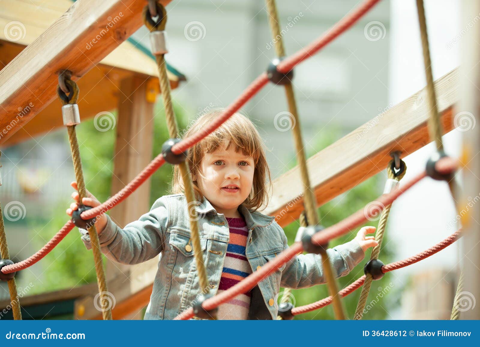 The girl climbs the ropes stock photo. Image of girl 36428612