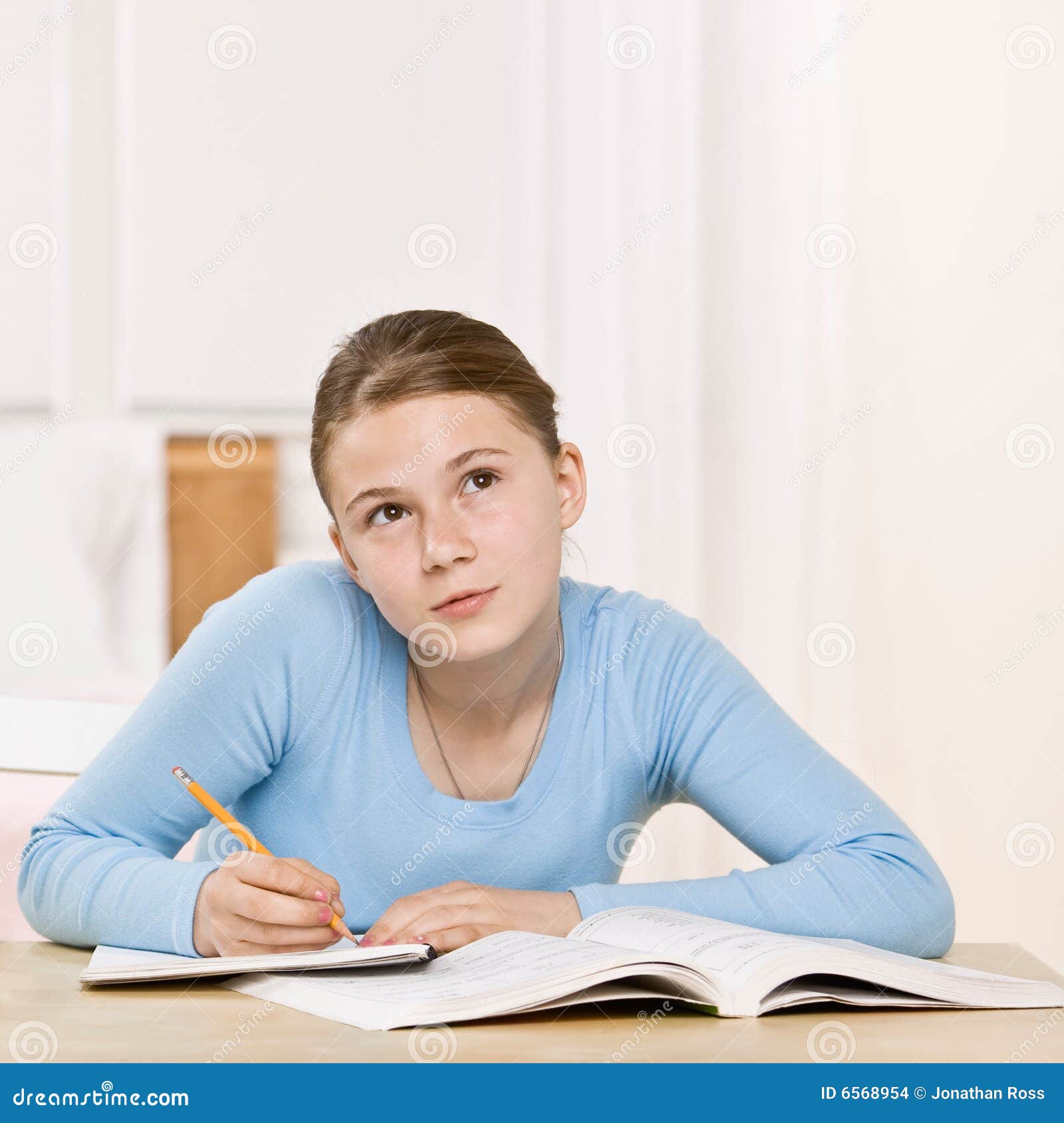 girl concentrating on homework assignment