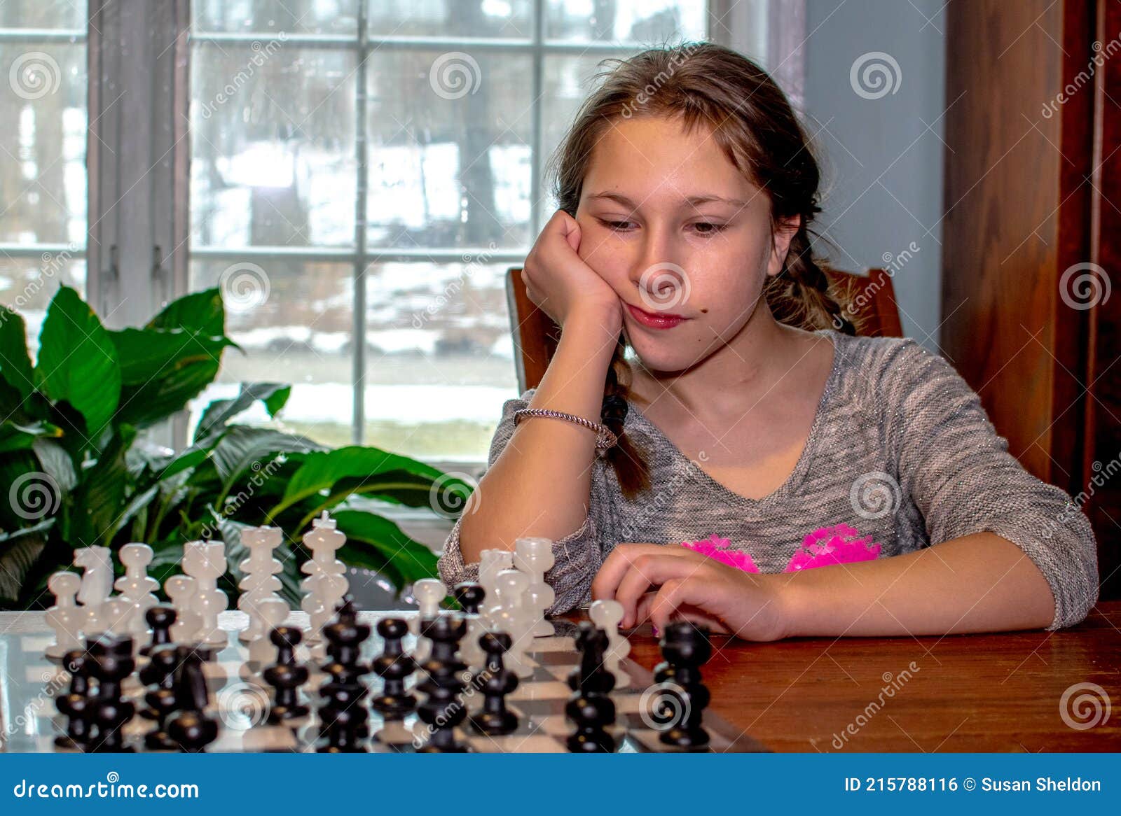 Children's Restraining Hand Thoughtfully Figure Before The Next Chess Move  Stock Photo, Picture and Royalty Free Image. Image 77247675.