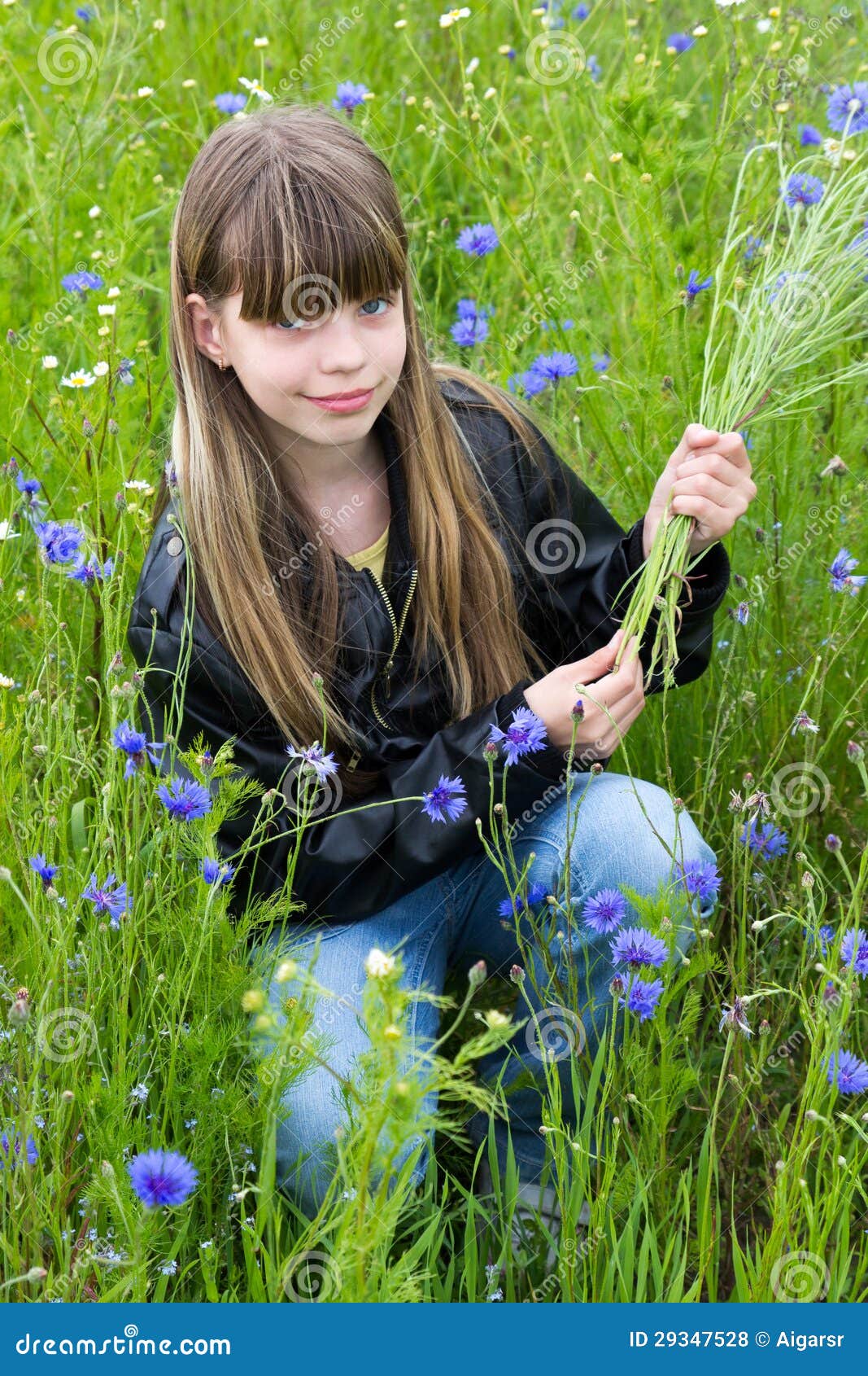 Girl with cornflower stock photo. Image of person, blue 29347528