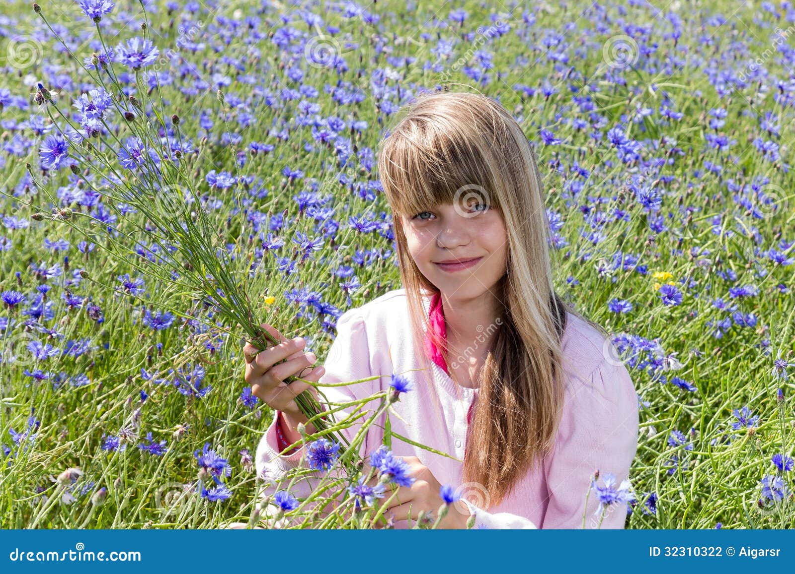 Girl in cornflower field stock photo. Image of spring 32310322