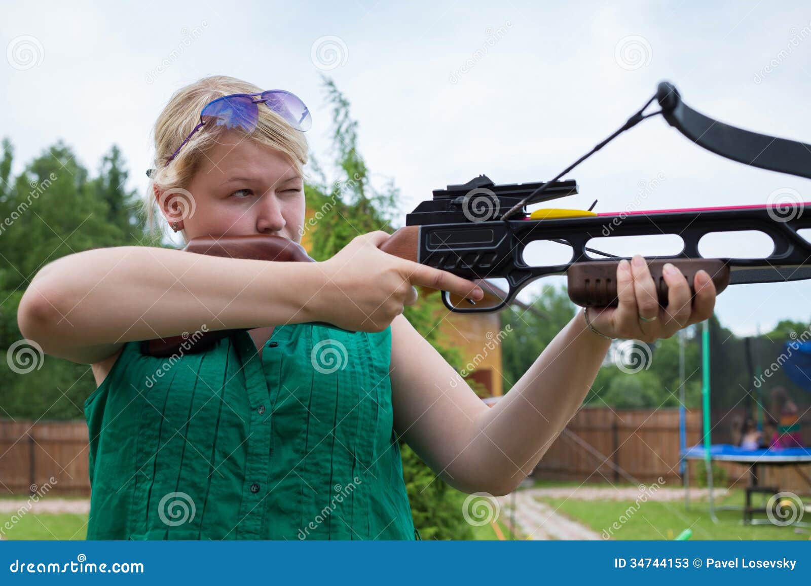 A Girl With A Crossbow Aiming At A Target Stock Image Image 34744153
