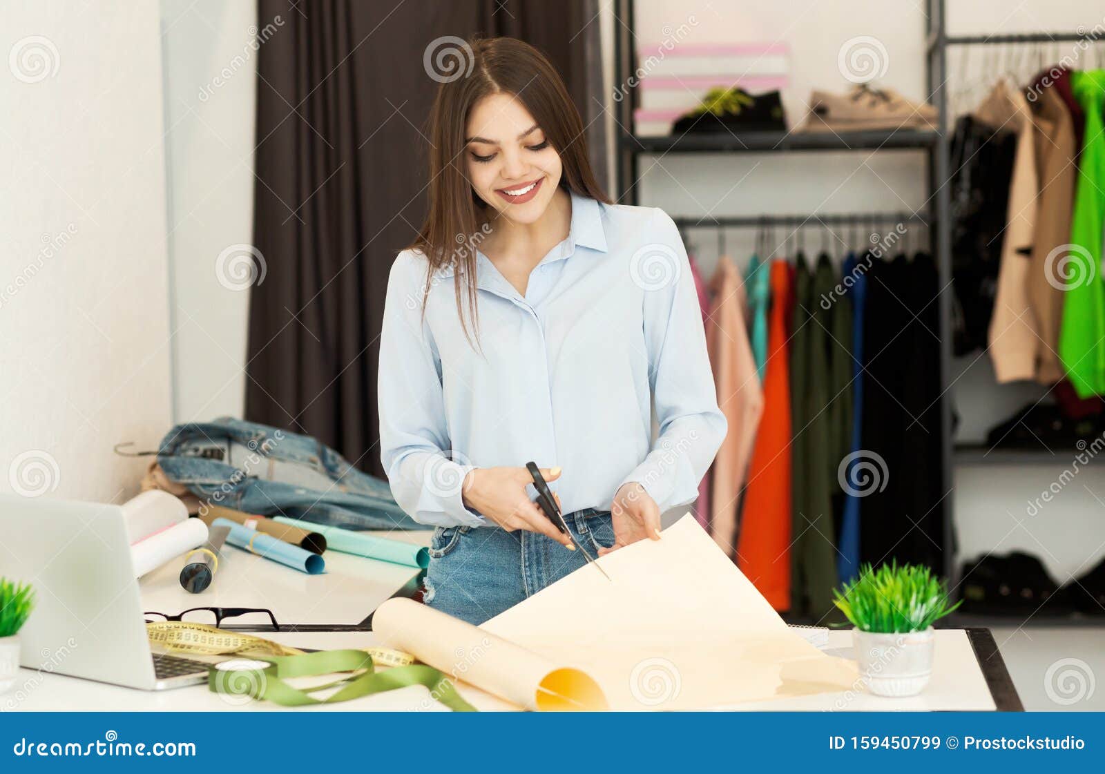 Girl Cutting Fabric Working on Fashion Clothing Collection in Workshop ...