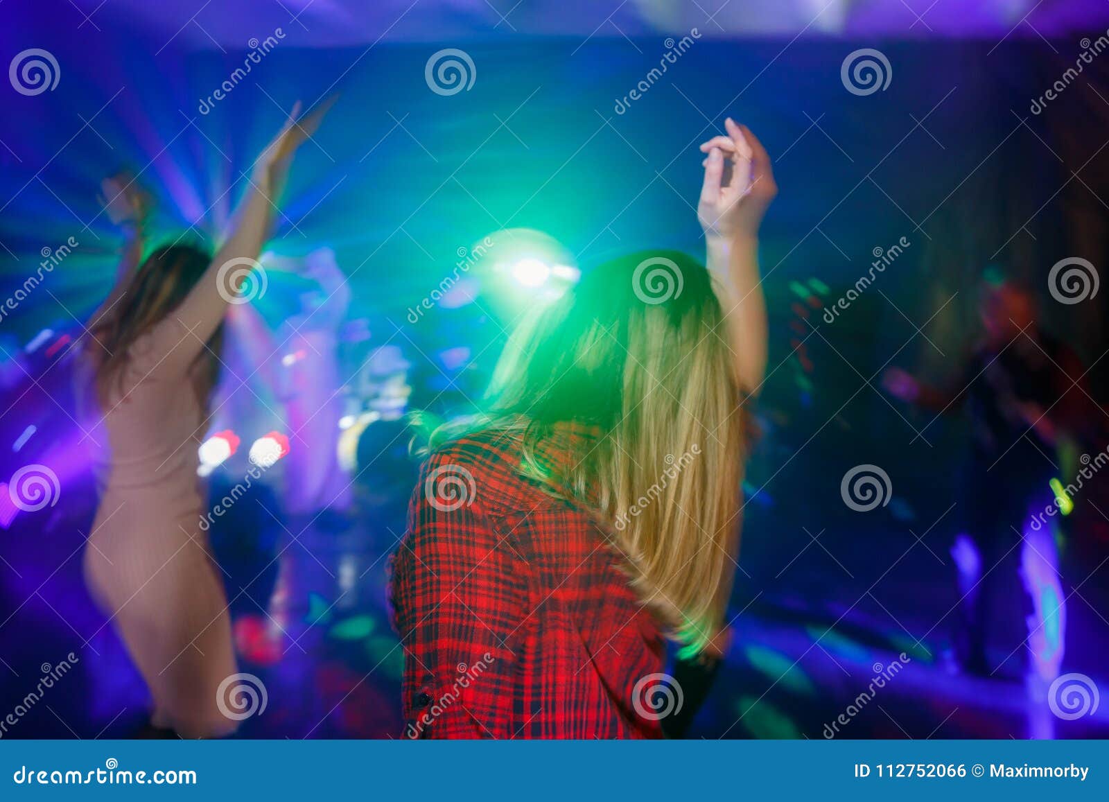 The Girl is Dancing with Her Back on the Dance Floor. Multicolored ...