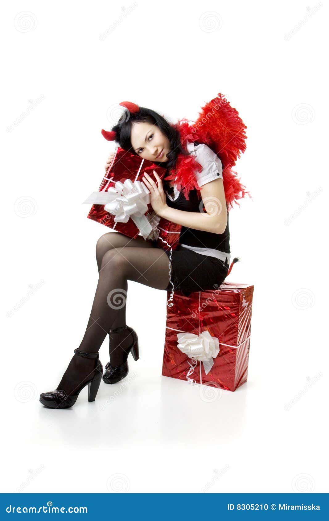 Picture of a girl in a devil costume with a gift