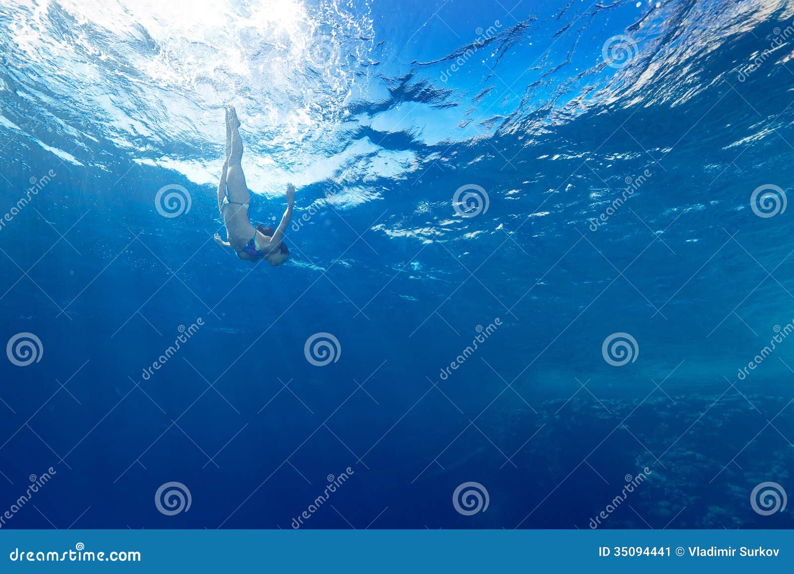 Girl diving under the sea stock image. Image of health 35094441