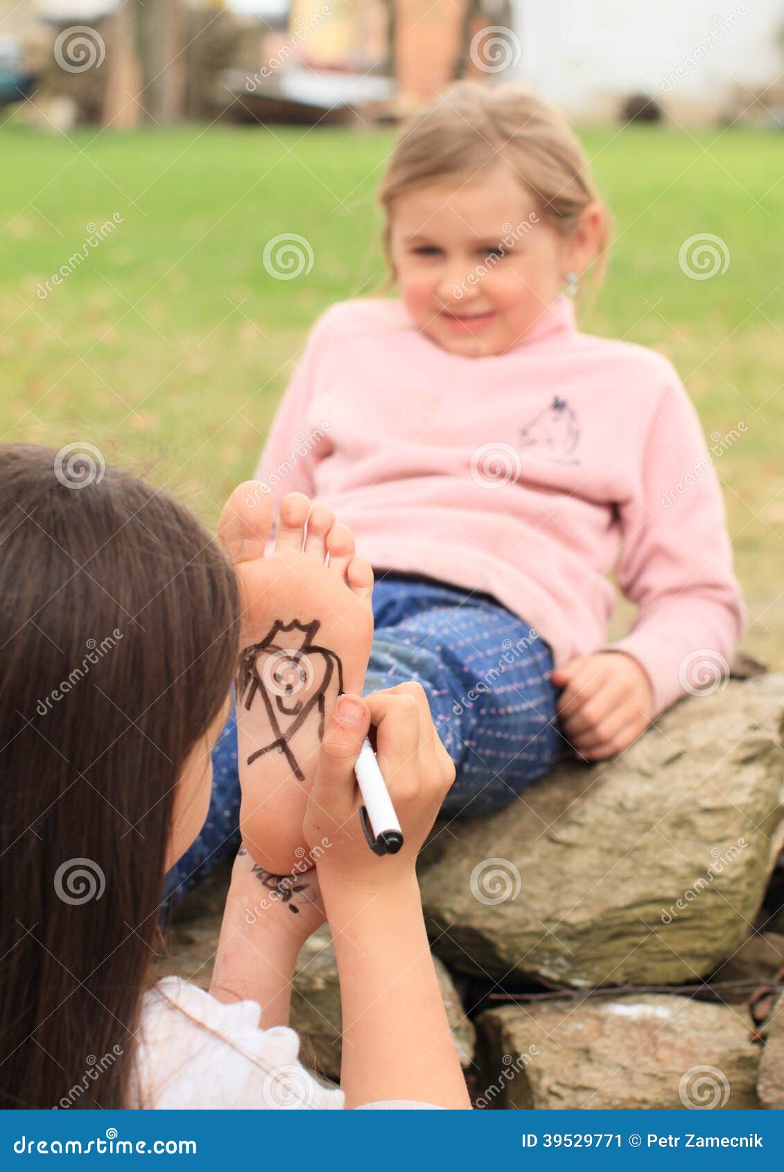 girl drawing hearts on sole