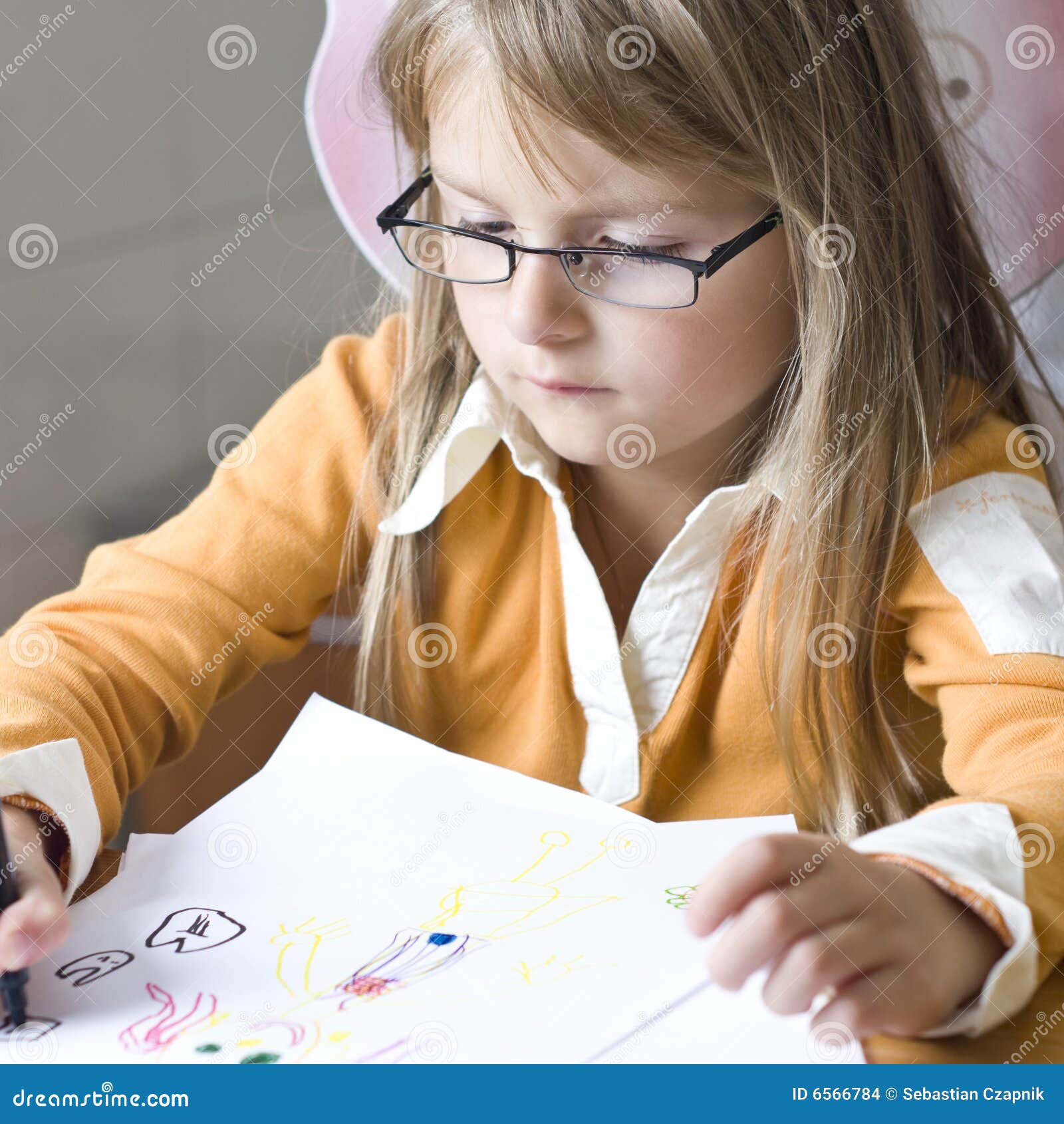 girl drawing at home