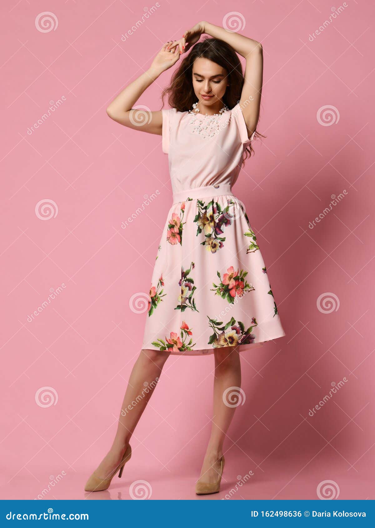 Girl in Dress for a Date - a Blouse and a Fluffy Skirt Posing in the Studio  on a Pink Background. To Meet Spring and Summer. Stock Photo - Image of  curly,