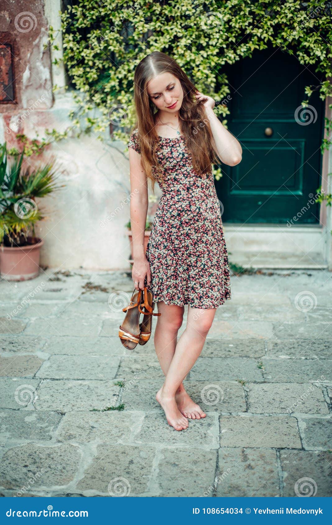 Girl in a Dress Strolls by a Cozy Old Courtyard Stock Photo - Image of ...