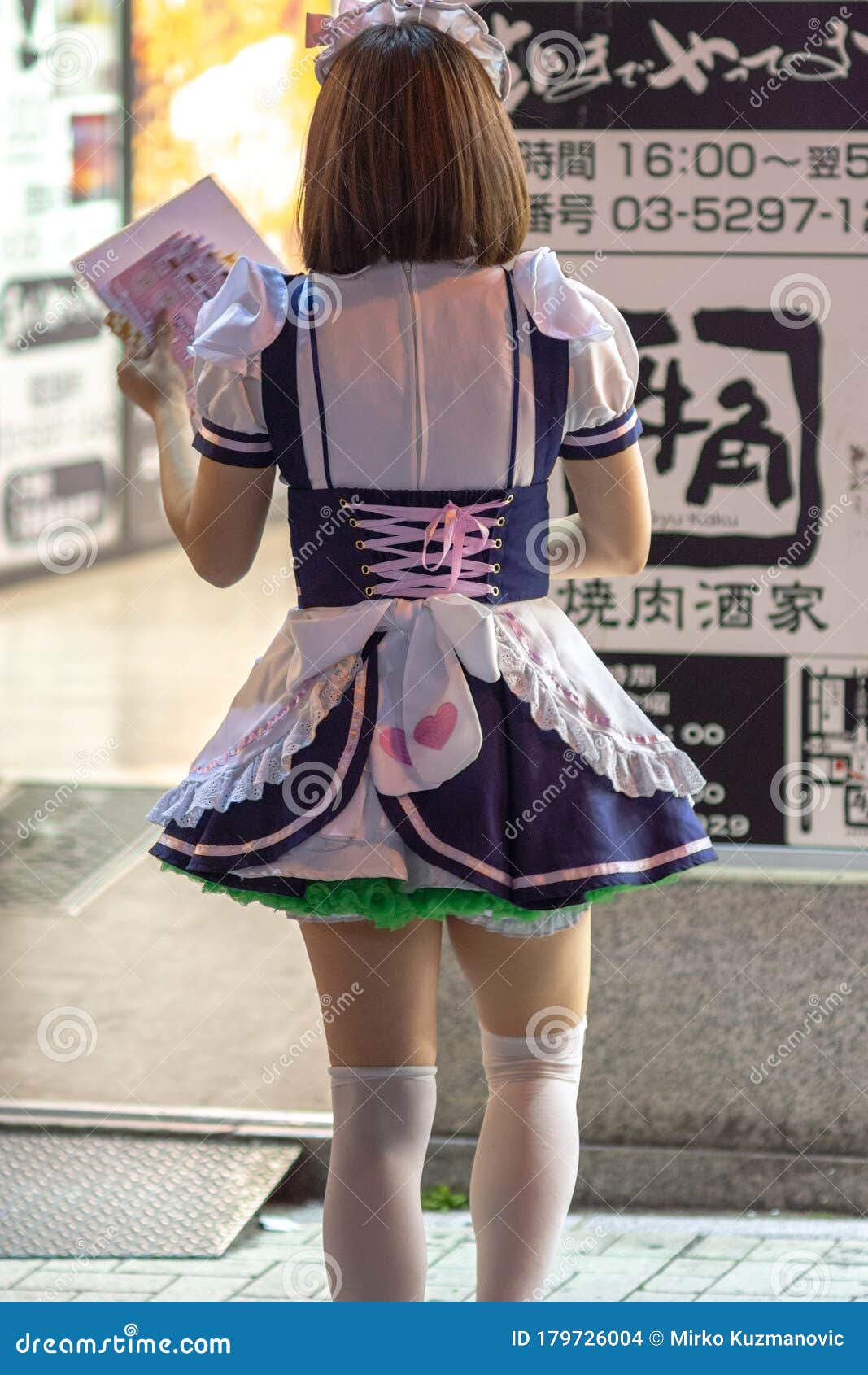 Girl Dressed In French Maid Costume In Akihabara Editoria