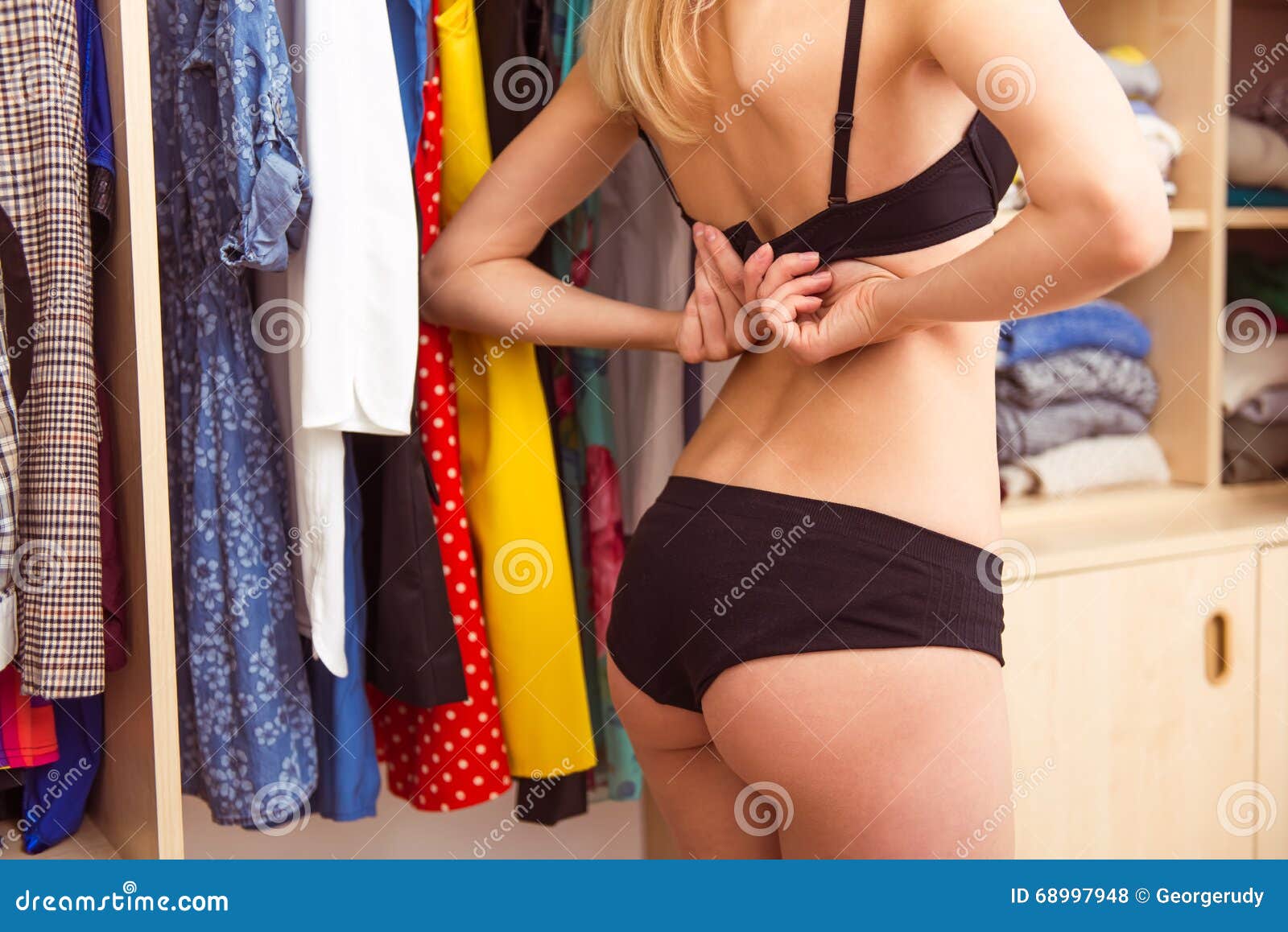 Dressing room girl puts on pink and then beige lingerie