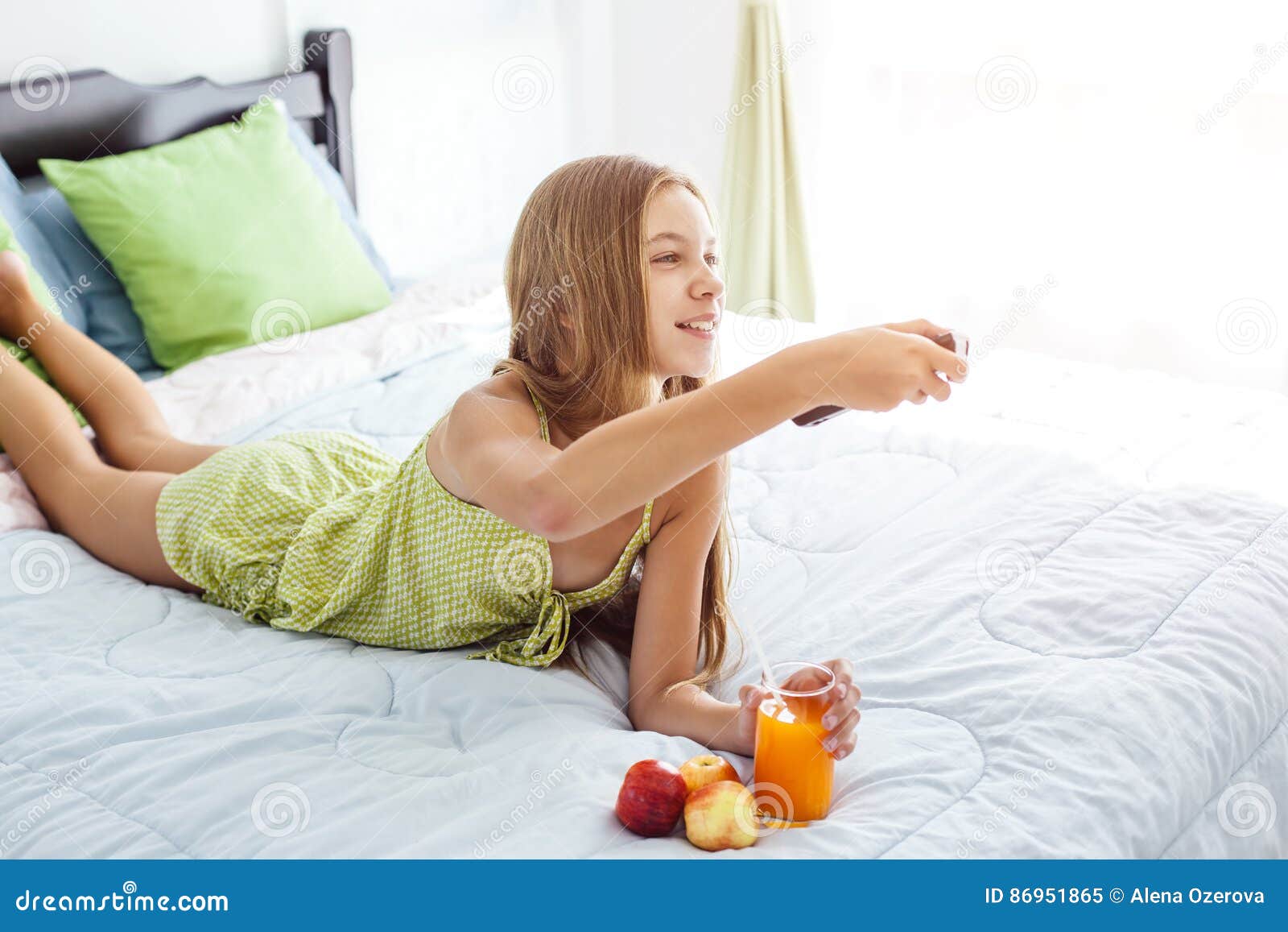 Girl Drinking Juice And Watching Tv In Bedroom Stock Image ...
