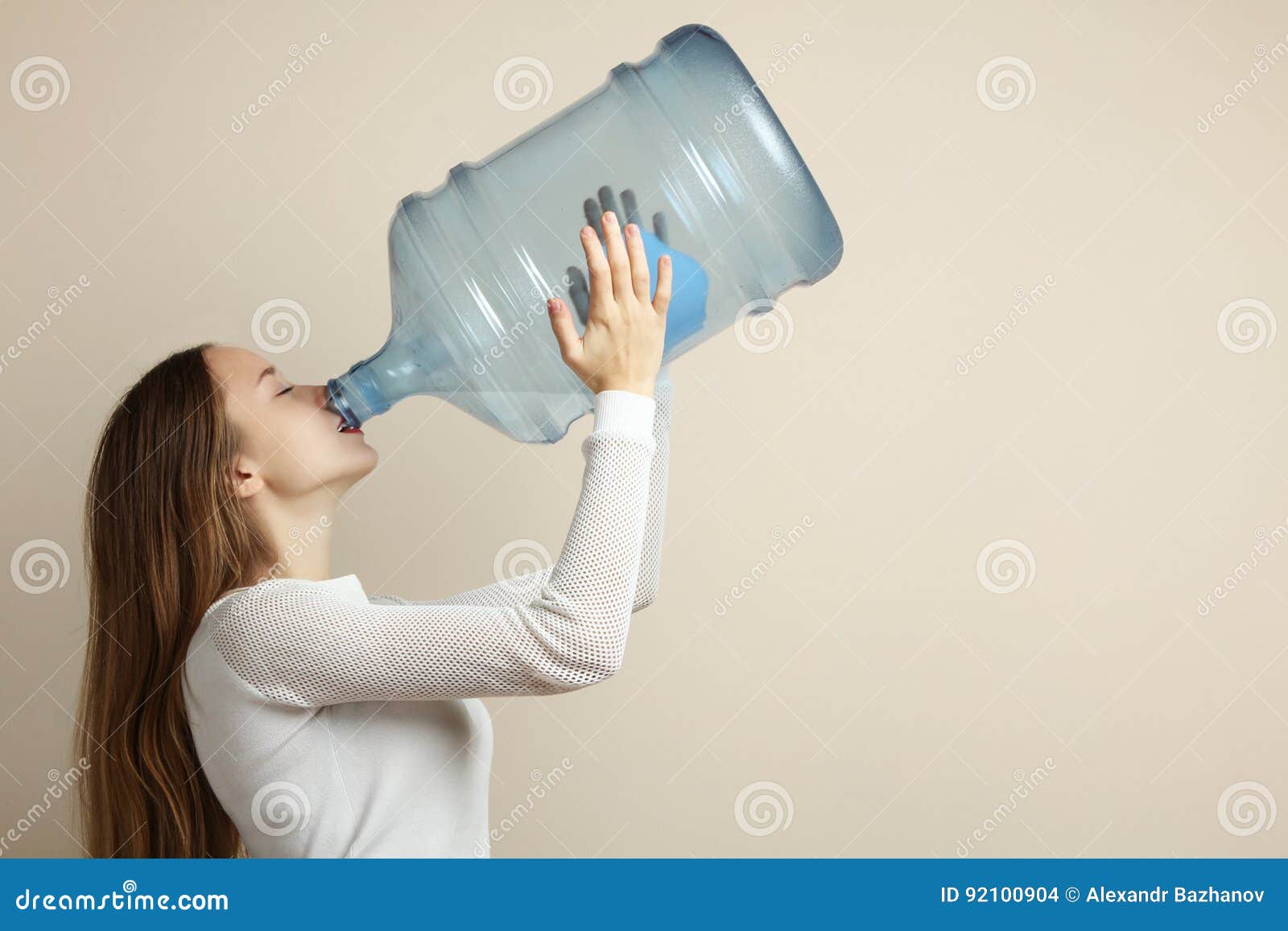 Teenage girl drinks water from bottle Stock Photo by ©BestPhotoStudio  64410247