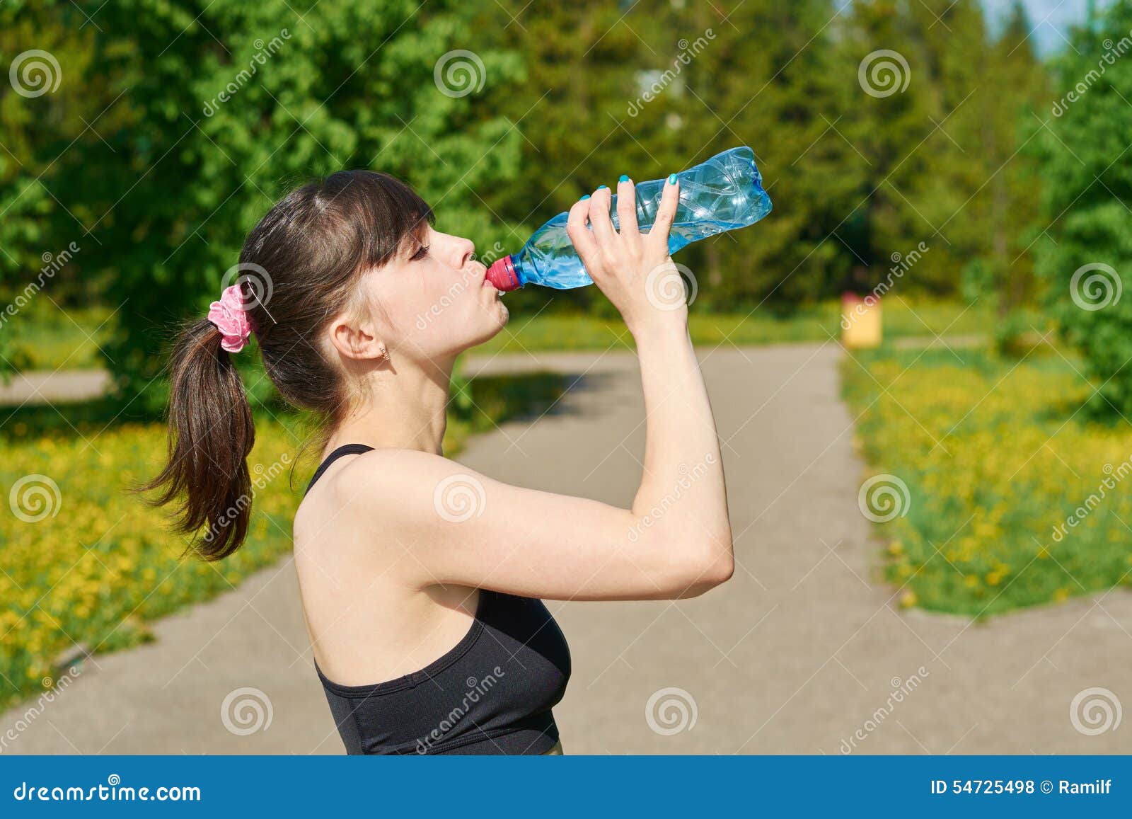 The Girl Drinks Water from a Plastic Bottle Stock Photo Image of body