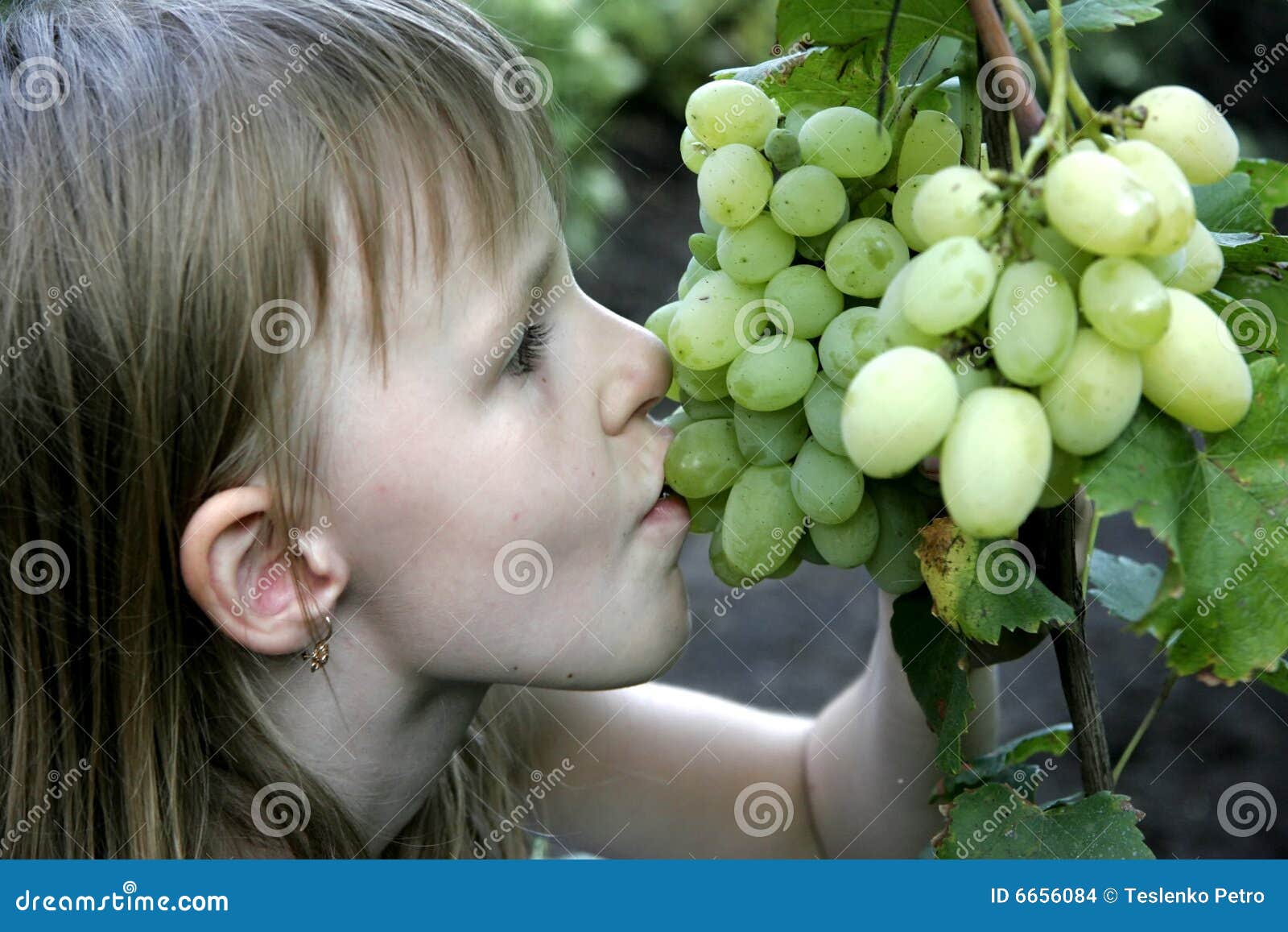 Girl eat the grape stock photo. Image of juicy, hungry 6656084