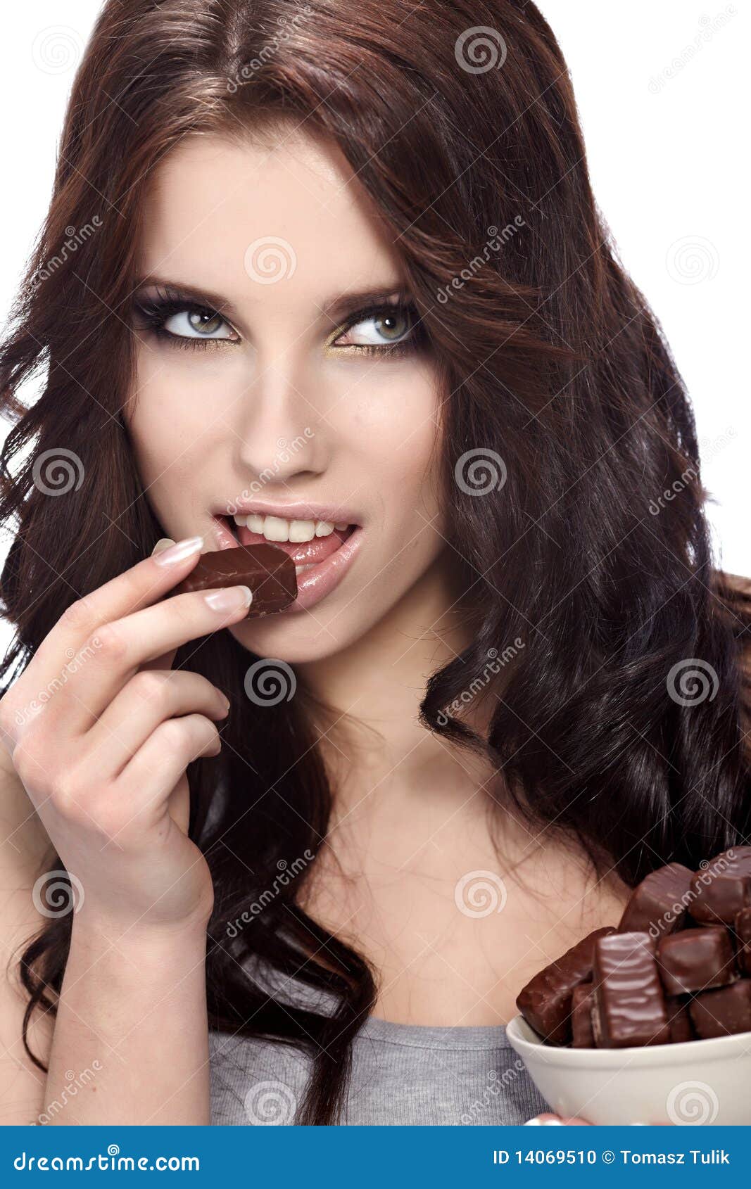 Girl eating a chocolate stock photo. Image of beautiful 14069510