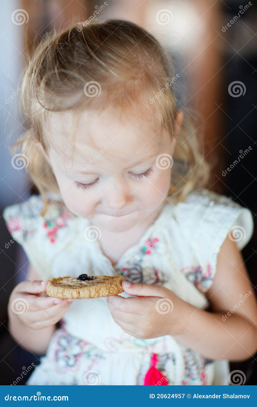 Girl eating cookie stock image. Image of young, little 20624957