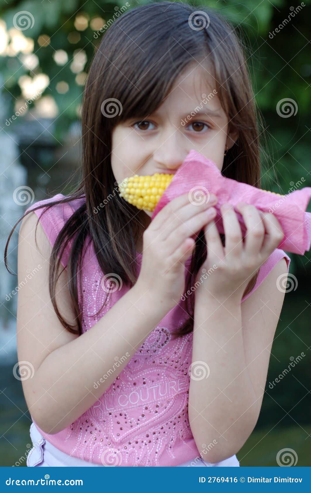Girl Eating Corn on the Cob Stock Photo Image of leafy, female 2769416