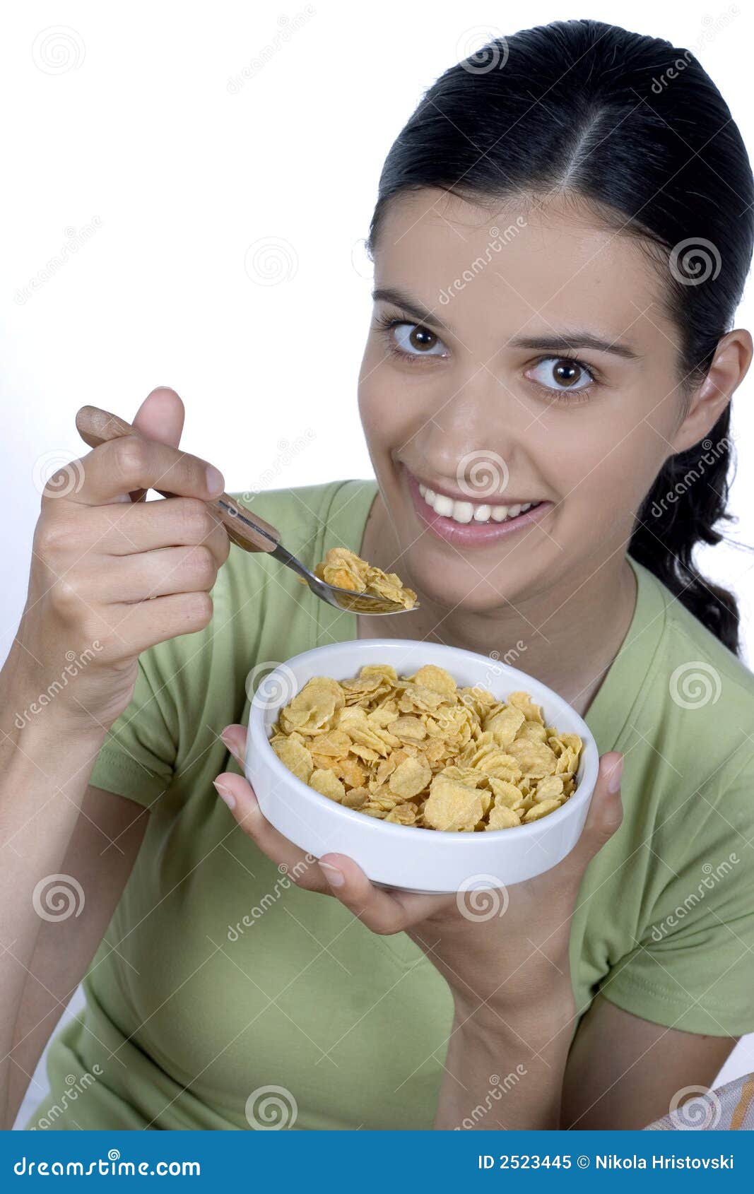 Girl eating cornflakes stock image. Image of diet, energy 2523445