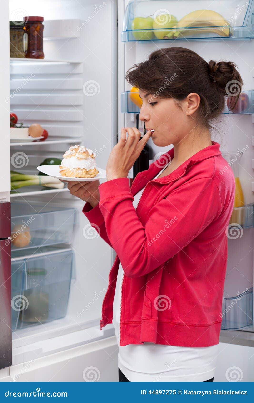 girl eating cream cake