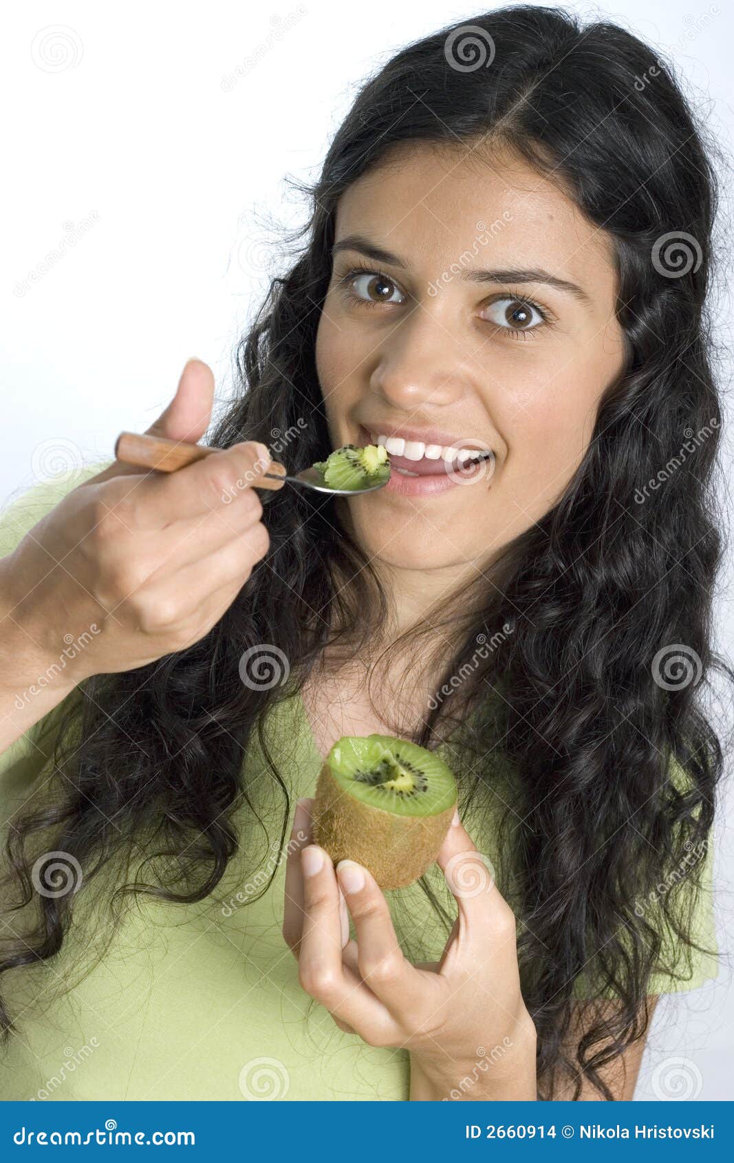 Girl eating kiwi stock photo. Image of nutrition, fruit 2660914