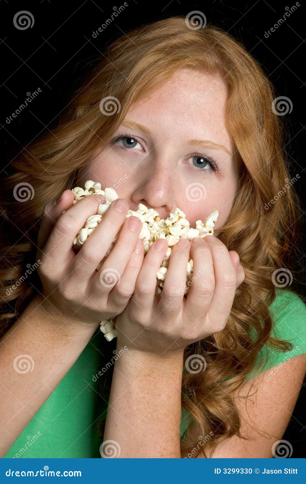 Girl Eating Popcorn stock photo. Image of hand, hands 3299330