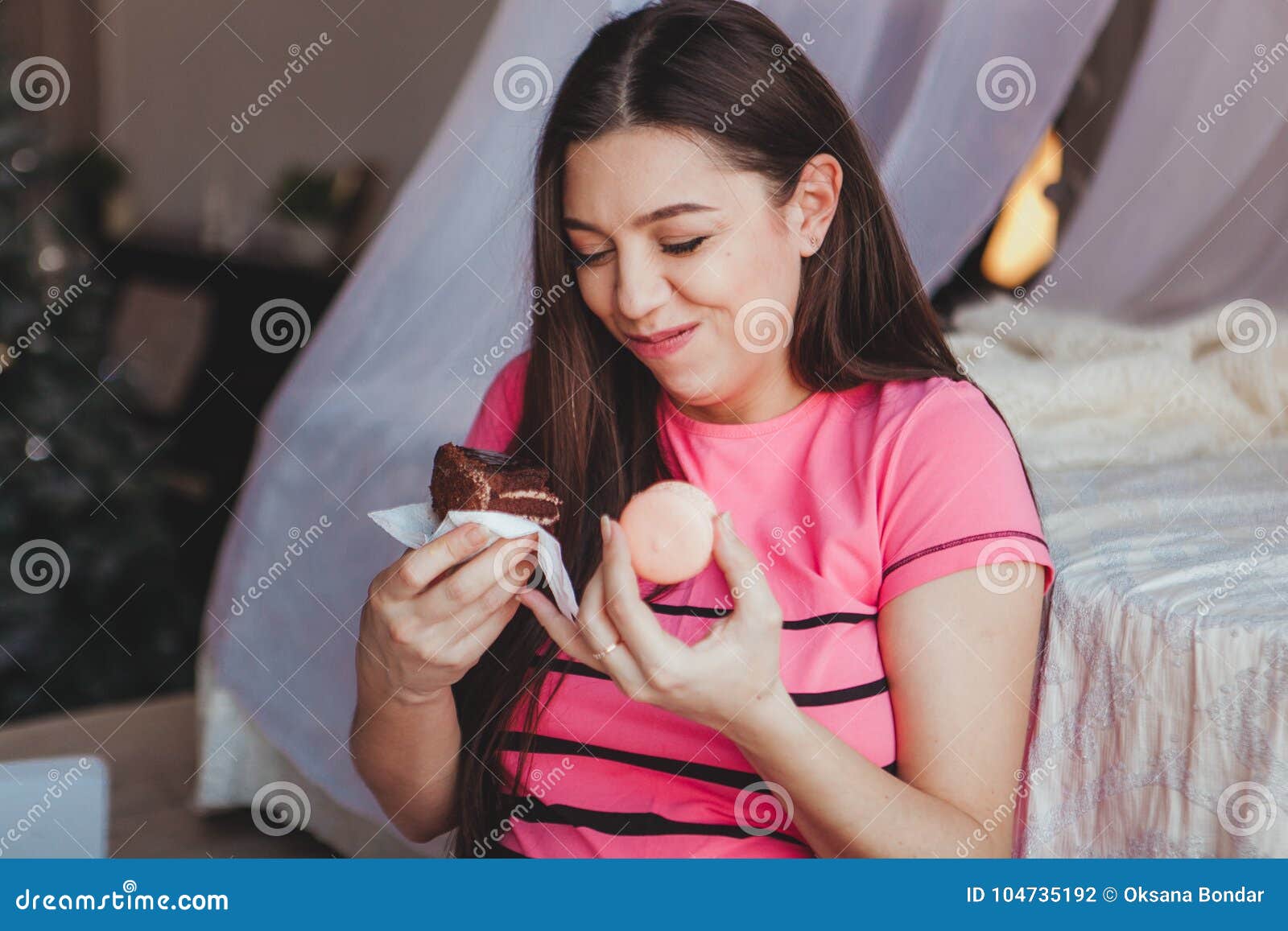 Girl Eating Tasty Browny Cake With In Bedroom. Sweet