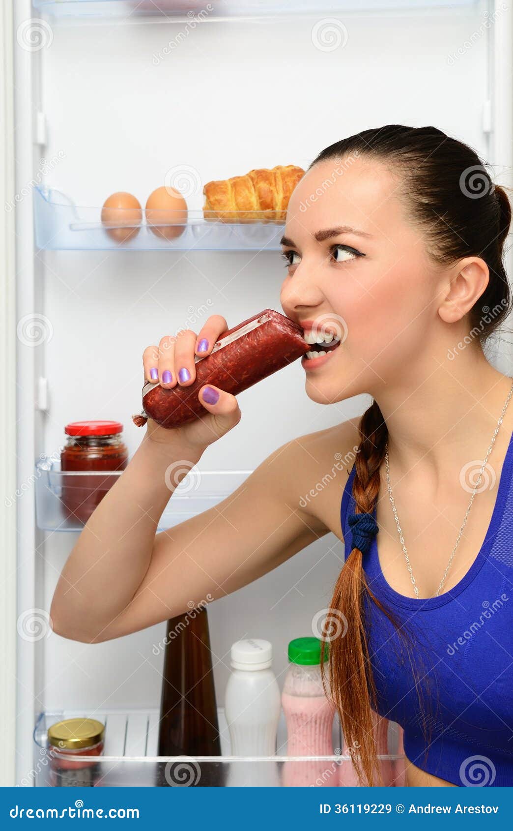 woman eating sausage