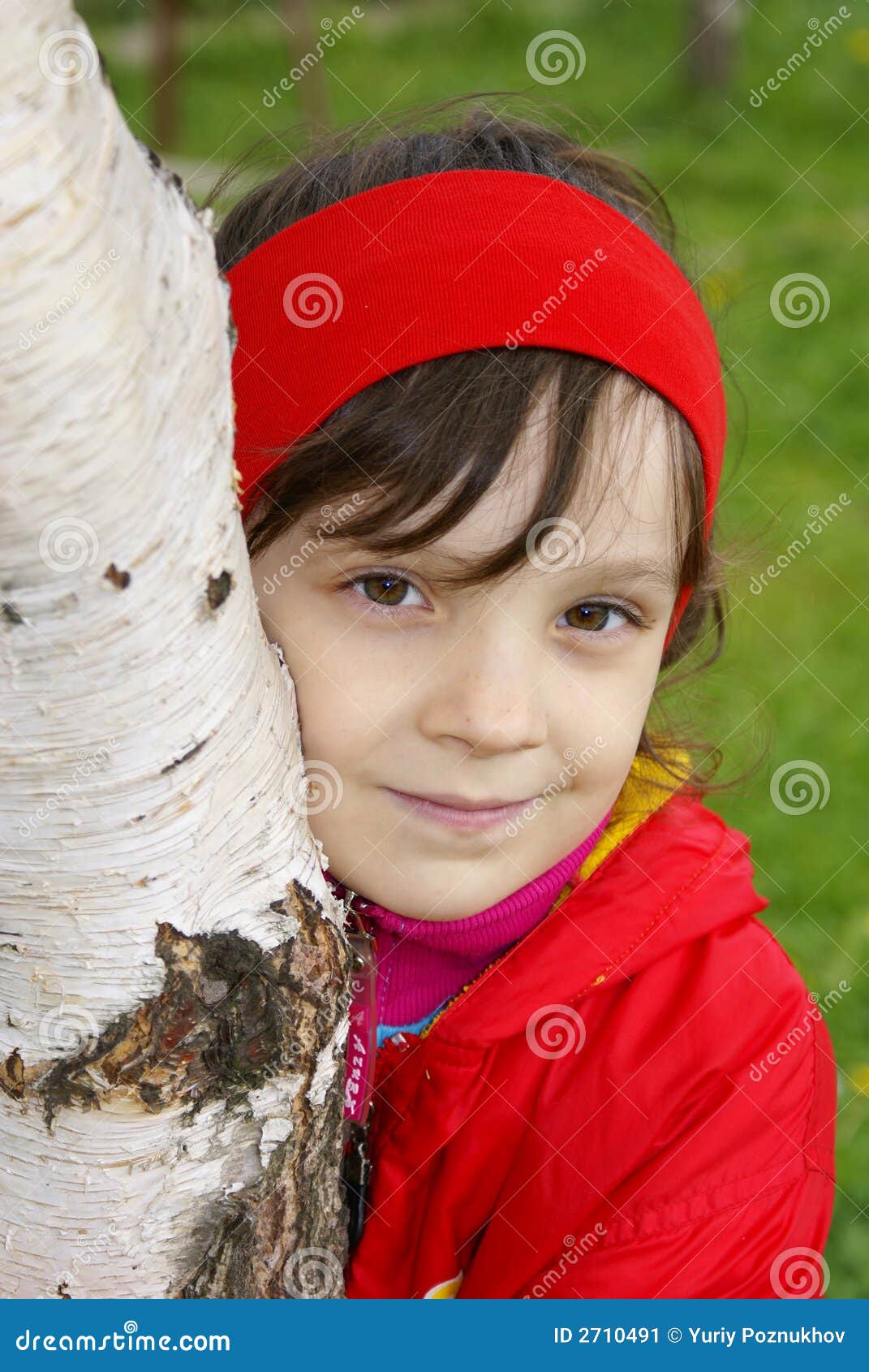 the girl embraces a birch