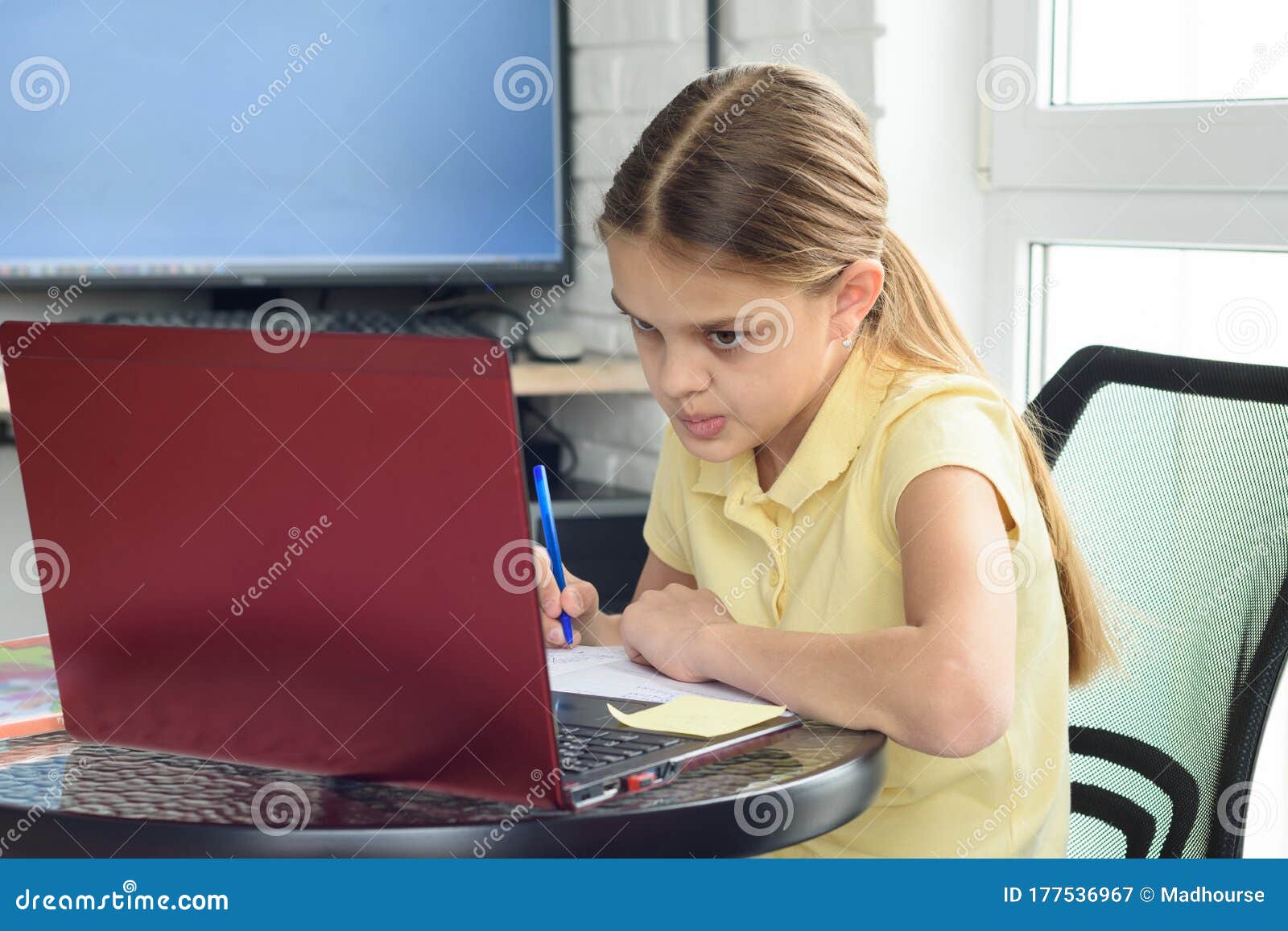 the girl is engaged in additional tutoring online