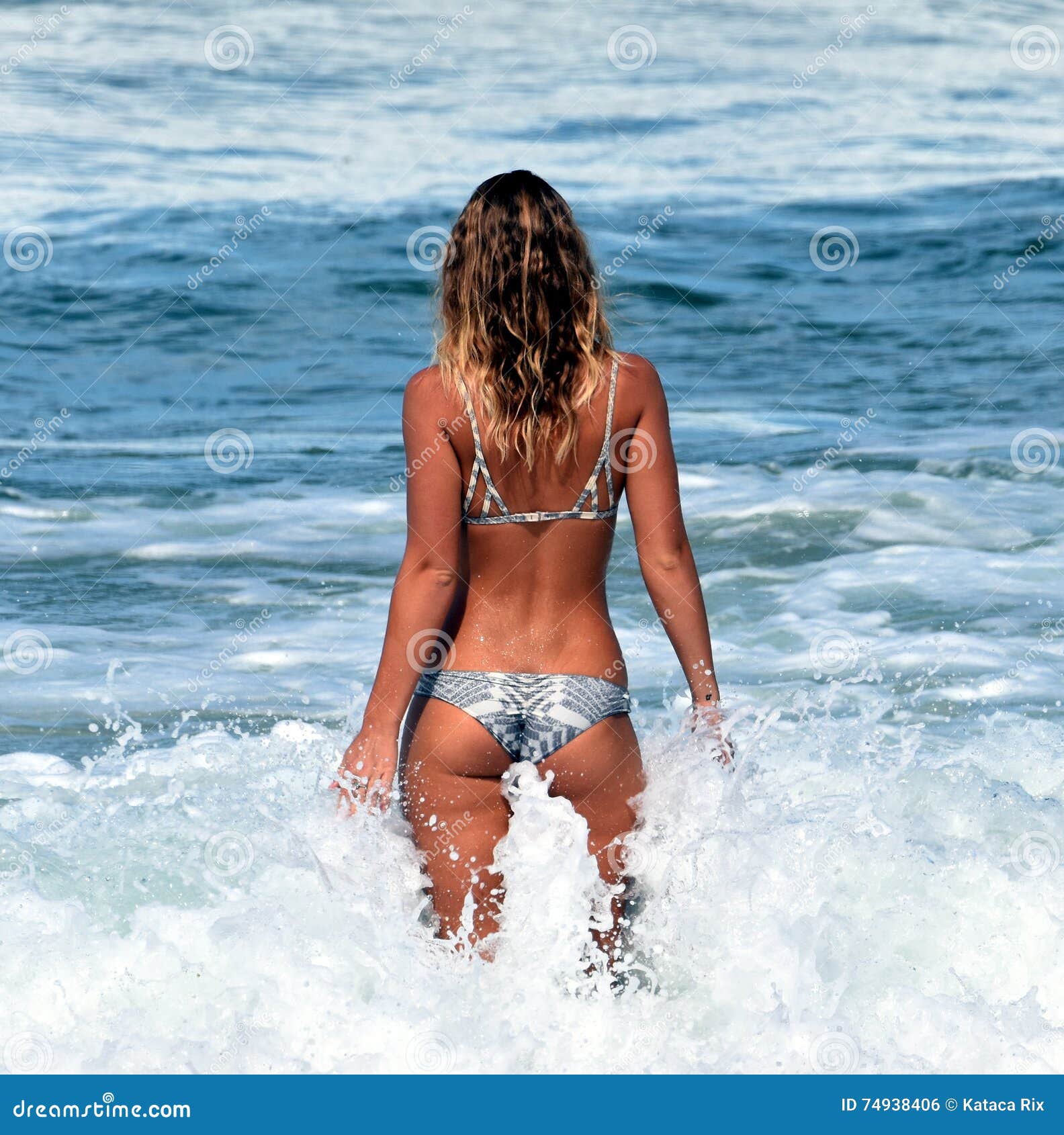 Girl enjoying the waves editorial photo picture