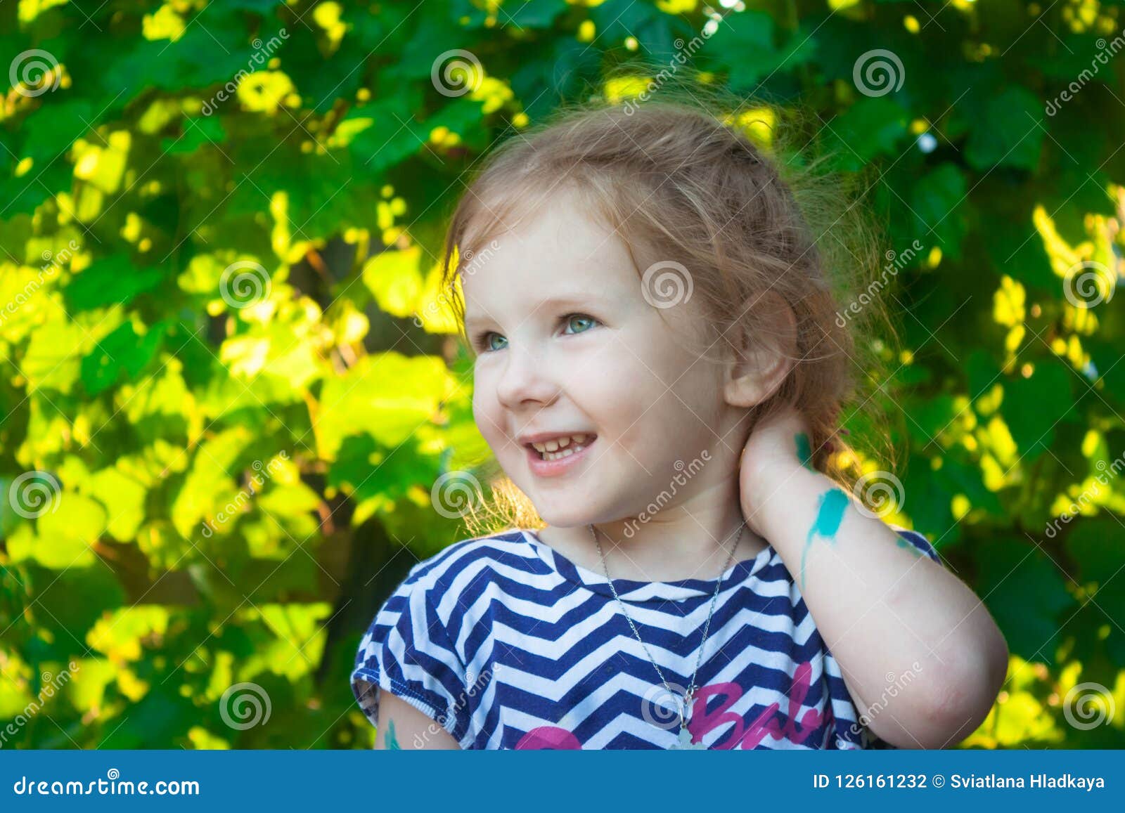 The Girl are Face on a Background of Green Grape Leave Stock Photo ...