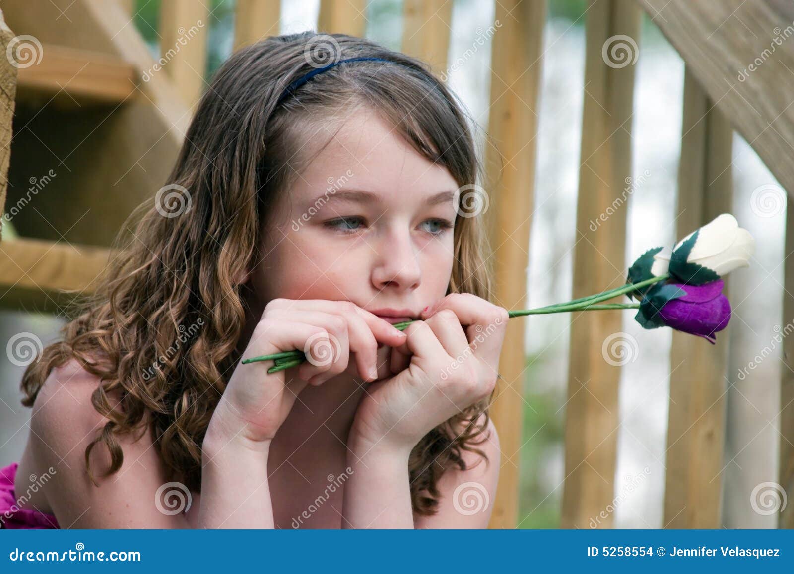 A Girl With Flowers Wondering Stock Photo Image of sitting, mournful