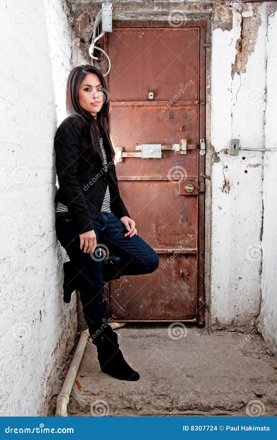 Girl in front of door stock photo. Image of concrete, brown - 8307724